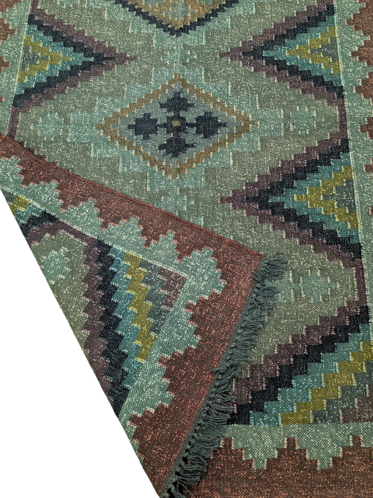 Inspired by the serene transition from day to night, the Dusk Haven Kilim Rug blends rich, moody hues with timeless geometric patterns. Handwoven by skilled artisans using premium wool, this flatweave rug features a mesmerizing diamond motif set against a soothing palette of deep teal, forest green, muted indigo, and earthy brown. The intricate stepped border adds a sense of structure while maintaining a soft, organic aesthetic.
