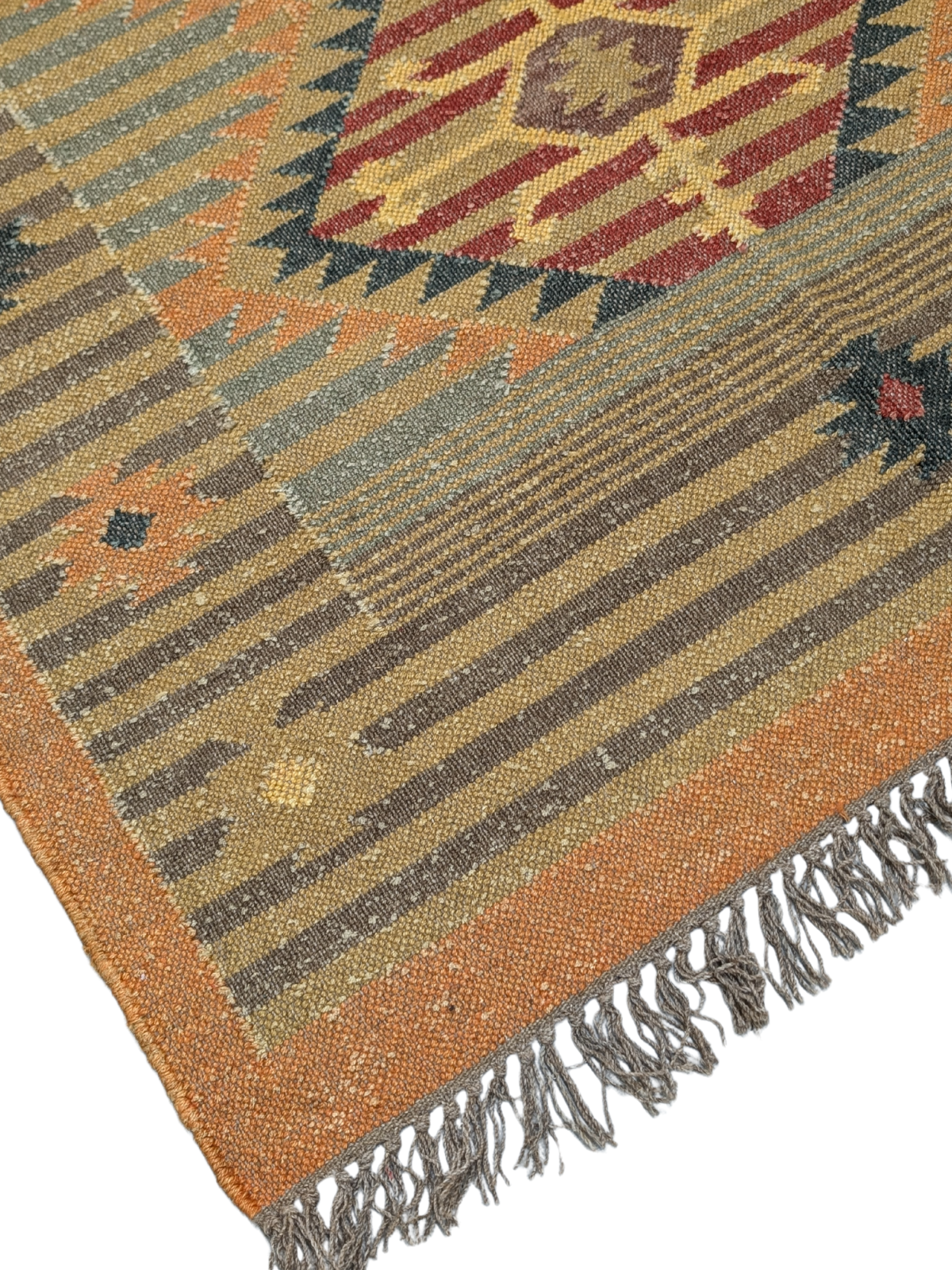 Inspired by the sunlit landscapes of the Southwest, the Golden Mesa Kilim Rug radiates warmth and character. Handwoven by skilled artisans using traditional techniques, this wool flatweave rug features a striking central medallion with intricate tribal motifs, framed by a structured border in golden ochre, deep red, and muted blue-gray tones. Subtle striped patterns and delicate geometric details enhance its timeless appeal.