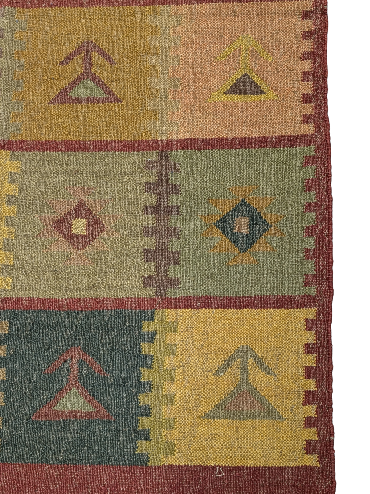 Inspired by the earthy hues of autumn fields, the Harvest Patch Kilim Rug is a timeless masterpiece that brings warmth and tradition into your home. Handwoven by skilled artisans using premium wool, this rug features a striking patchwork of geometric and tribal motifs, arranged in a harmonious grid-like formation. The palette of muted ochre, forest green, terracotta, deep maroon, and soft mustard captures the essence of nature’s bounty, making it a perfect addition to rustic, bohemian, or eclectic interiors