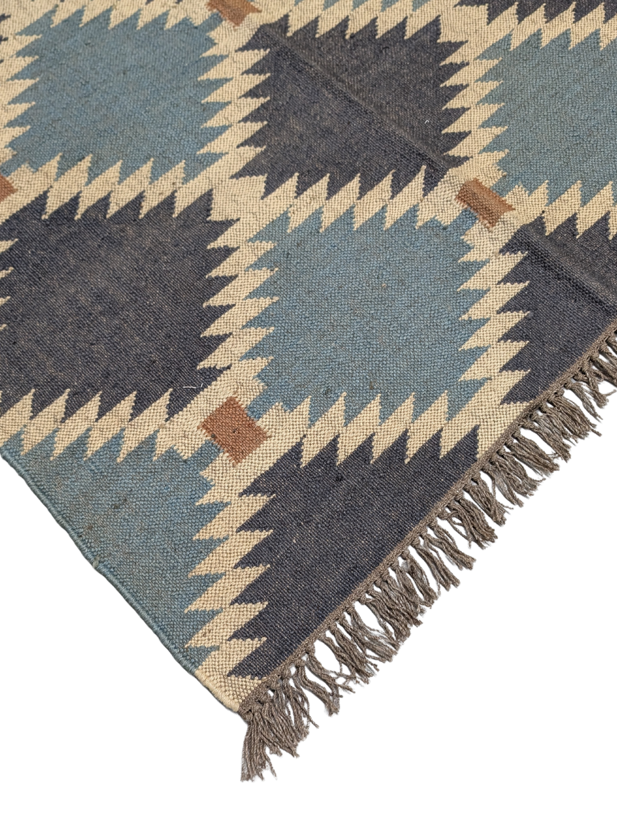 The Rustic Vistas Kilim Rug is a stunning handwoven masterpiece that blends timeless geometric design with a calming, earthy color palette. Featuring deep navy, soft sky blue, warm beige, and rustic brown, this flatweave wool rug is inspired by the natural landscapes of rolling hills and open skies. Its symmetrical tribal motifs create a bold yet balanced aesthetic, perfect for adding warmth and texture to your home.