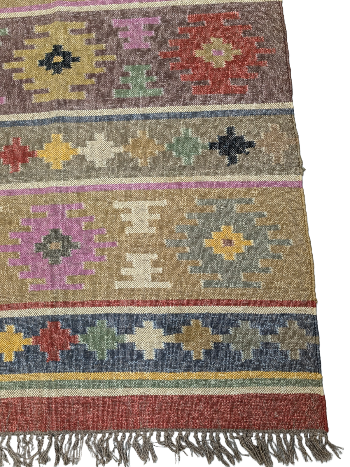 The Wanderer’s Mosaic Kilim Rug is a vibrant celebration of nomadic artistry, designed to infuse your space with eclectic charm and cultural richness. Handwoven by skilled artisans using premium wool, this rug showcases a mesmerizing patchwork of geometric and tribal motifs, arranged in striking horizontal bands. The warm, earthy palette—featuring deep reds, forest greens, golden yellows, rich purples, and soft neutrals—evokes the spirit of adventure and storytelling found in traditional kilim designs.