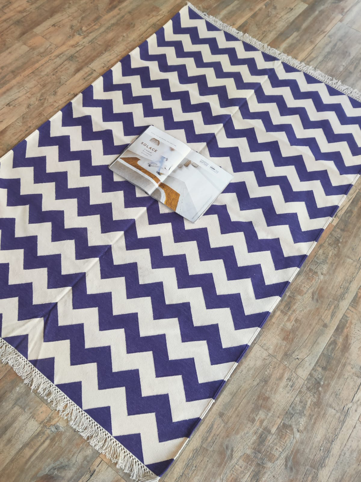 Amethyst Zigzag Cotton Rug cotton rug styled in a designed interior