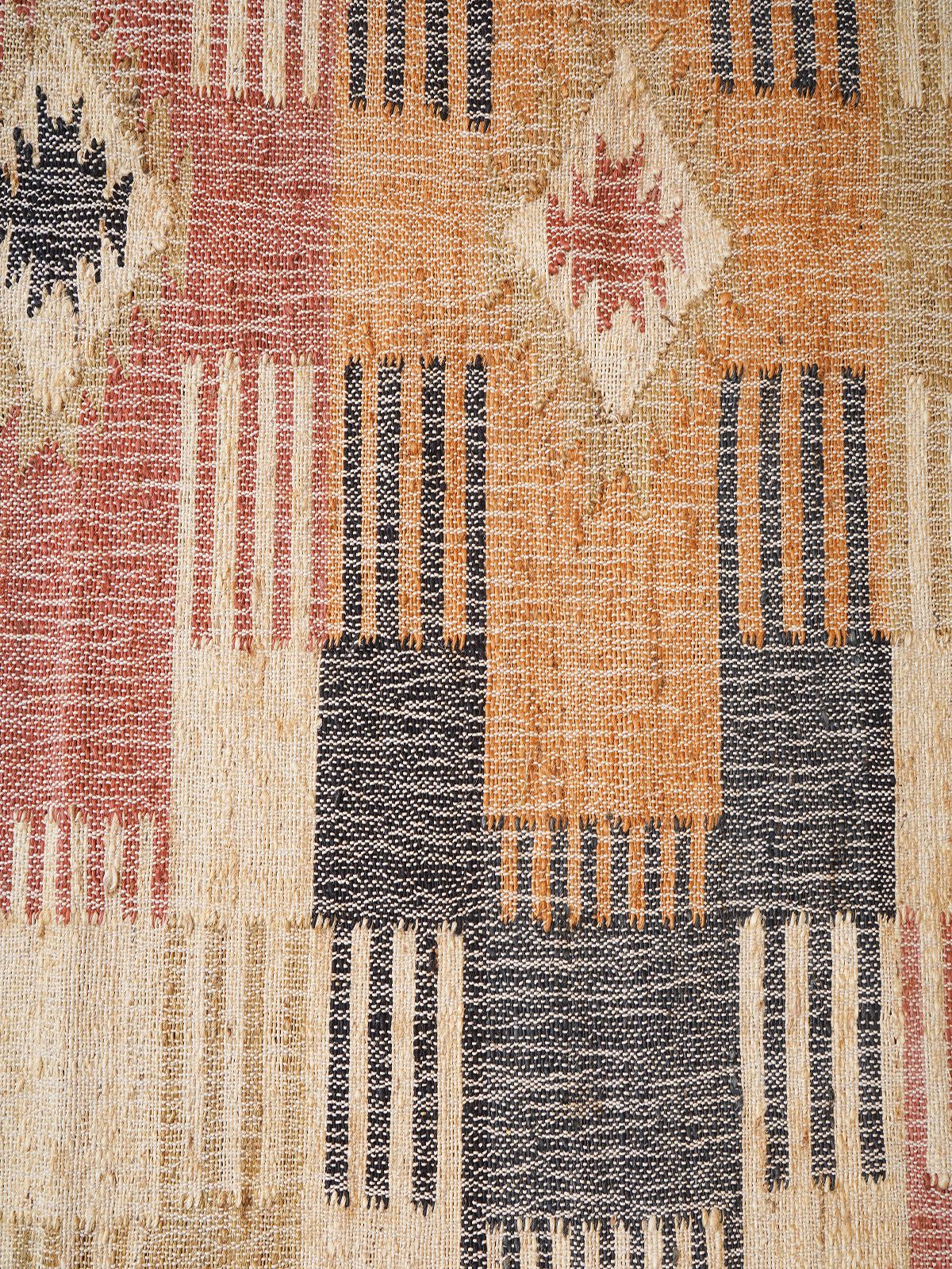 Ancient Trails Jute Kilim Rug jute rug styled in a living room interior