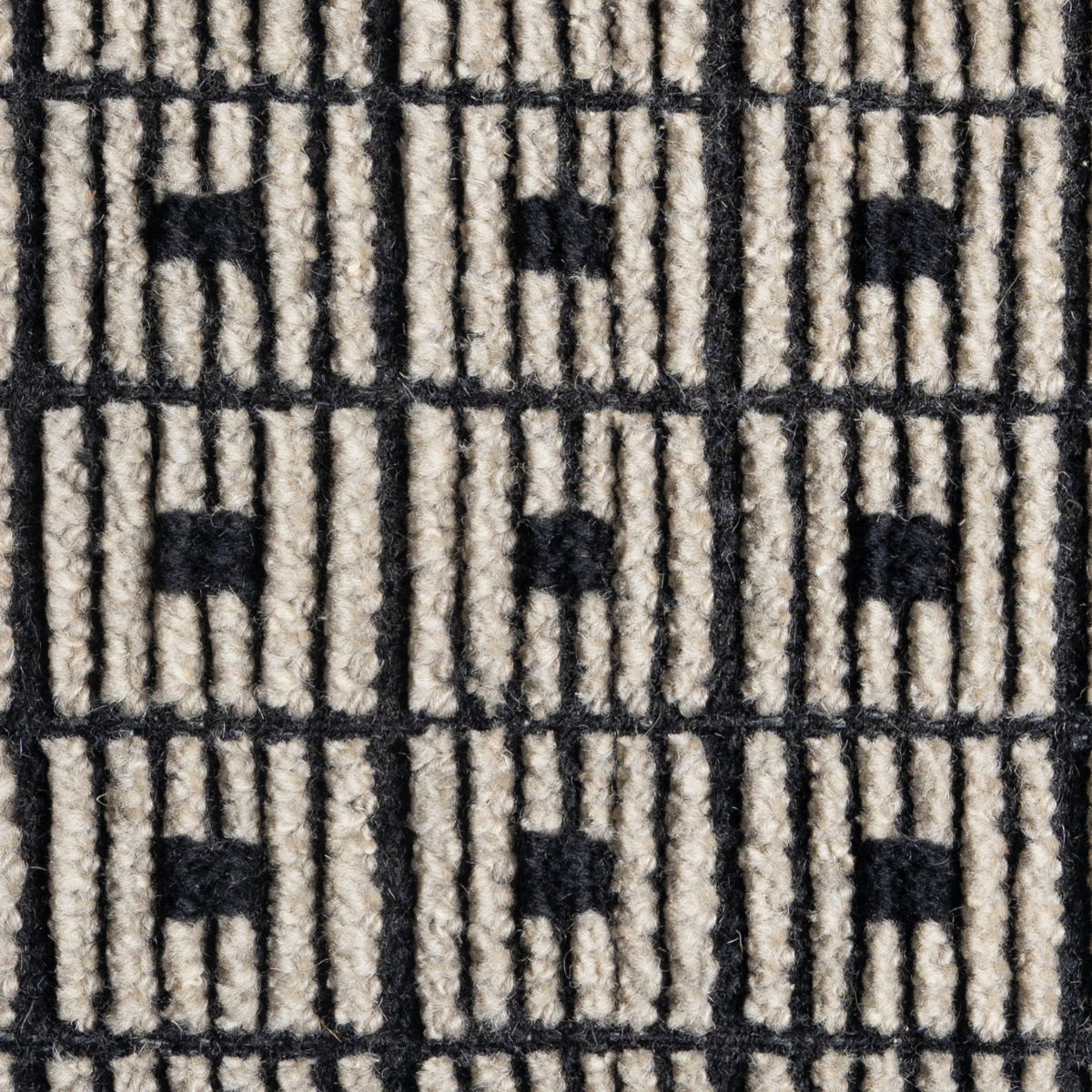 Artisan's Trace : Iron Lattice close-up showing the wool weave and geometric motif