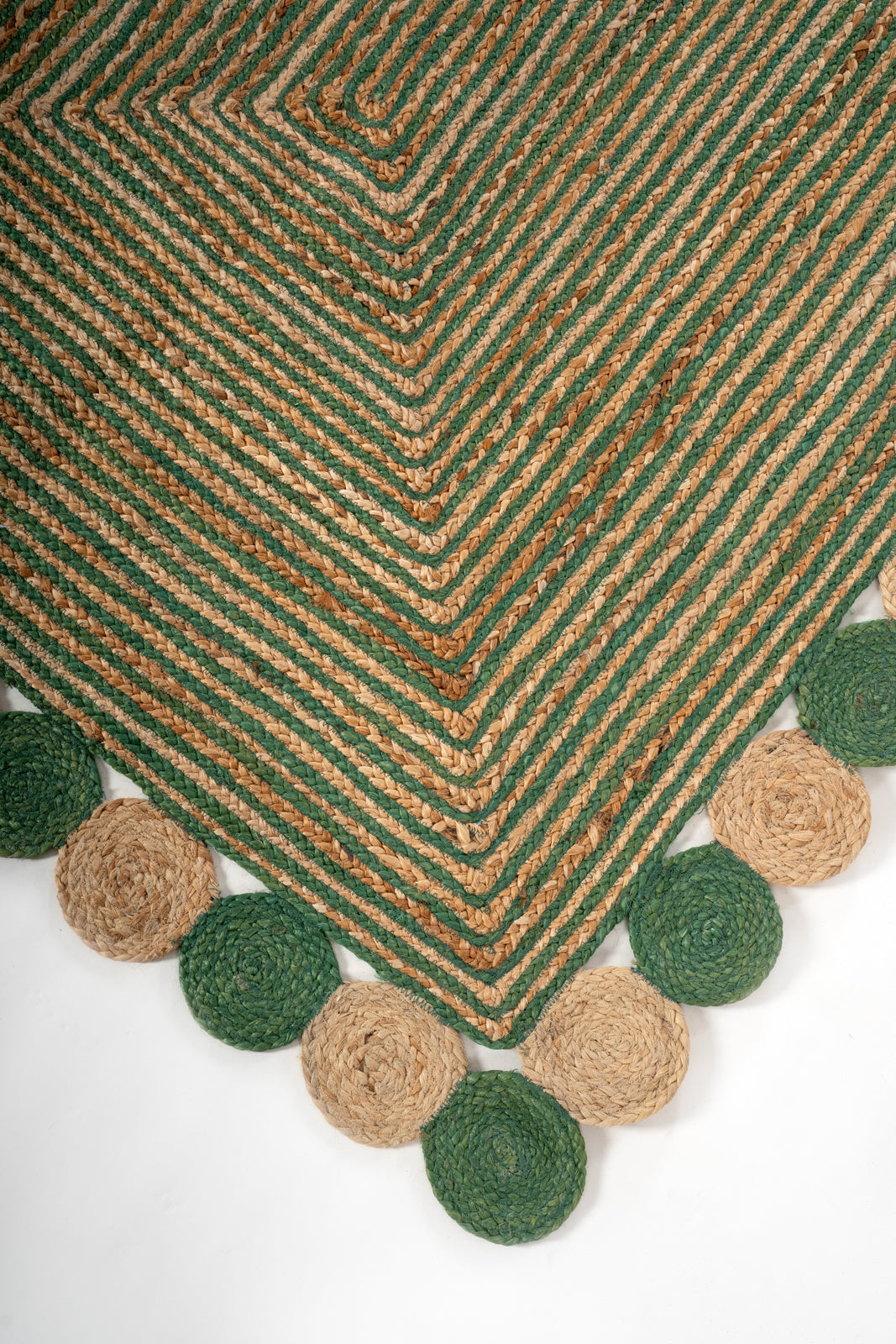 Asaba braided area rug close-up showing the cotton weave and surface texture