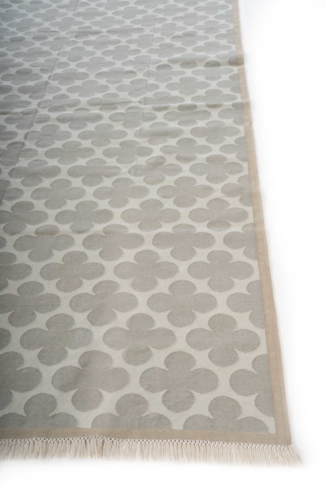 Ash Bloom Flatweave Rug cotton rug styled in a living room interior