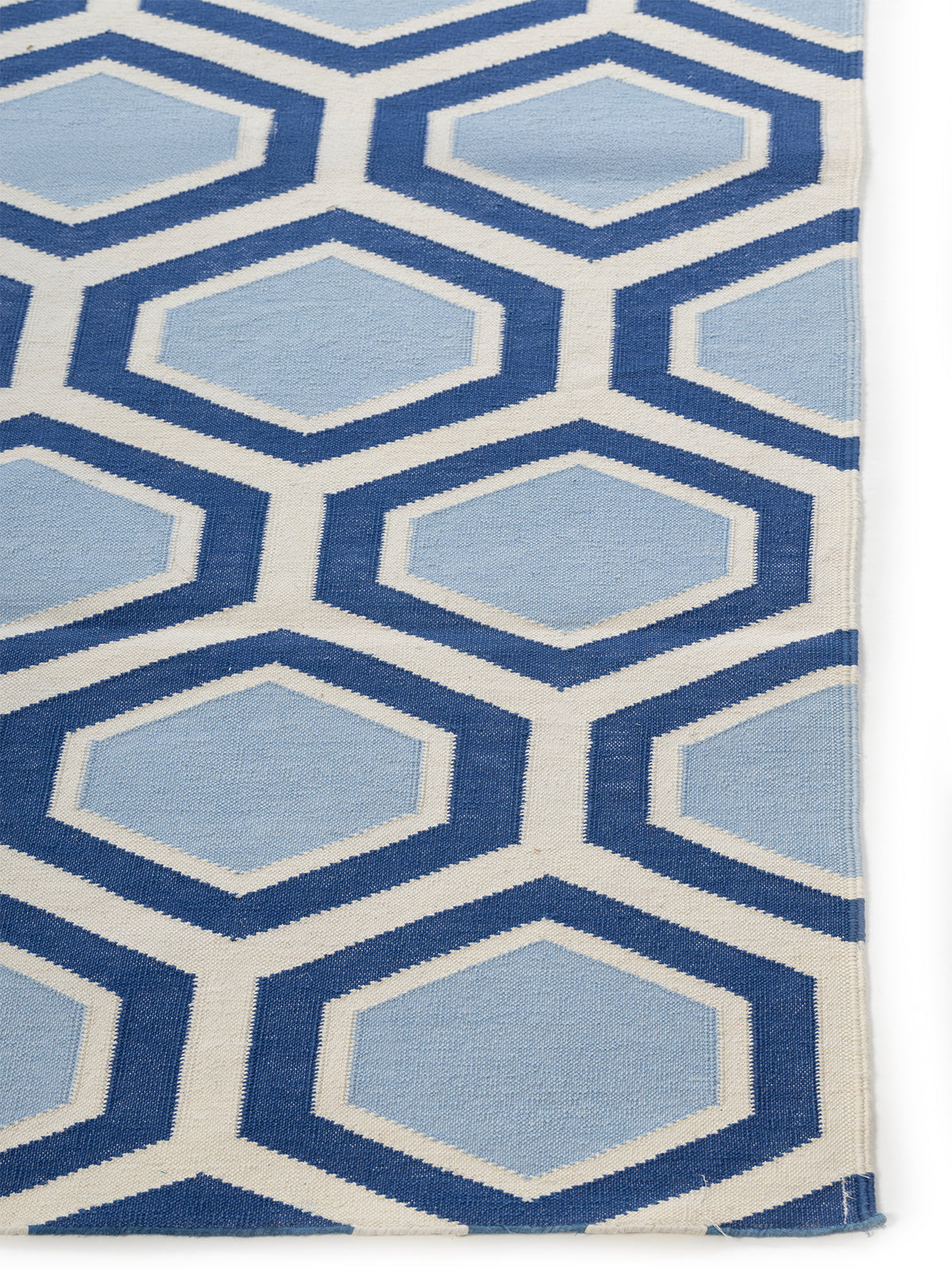 Azure Hive Flatweave Rug cotton rug styled in a living room interior