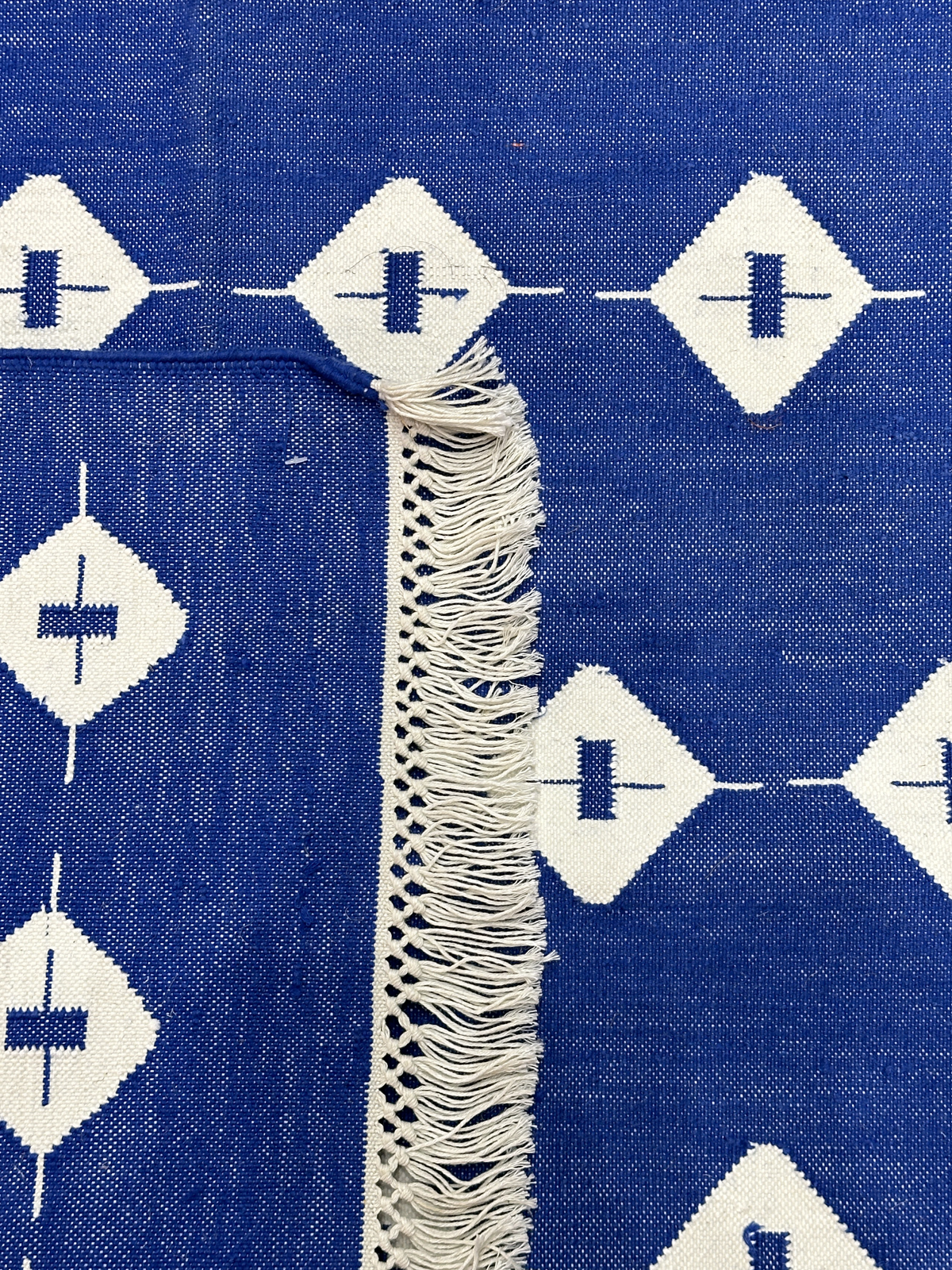Blue Haven Kilim Cotton Flatweave Rug close-up showing the cotton weave and traditional motif