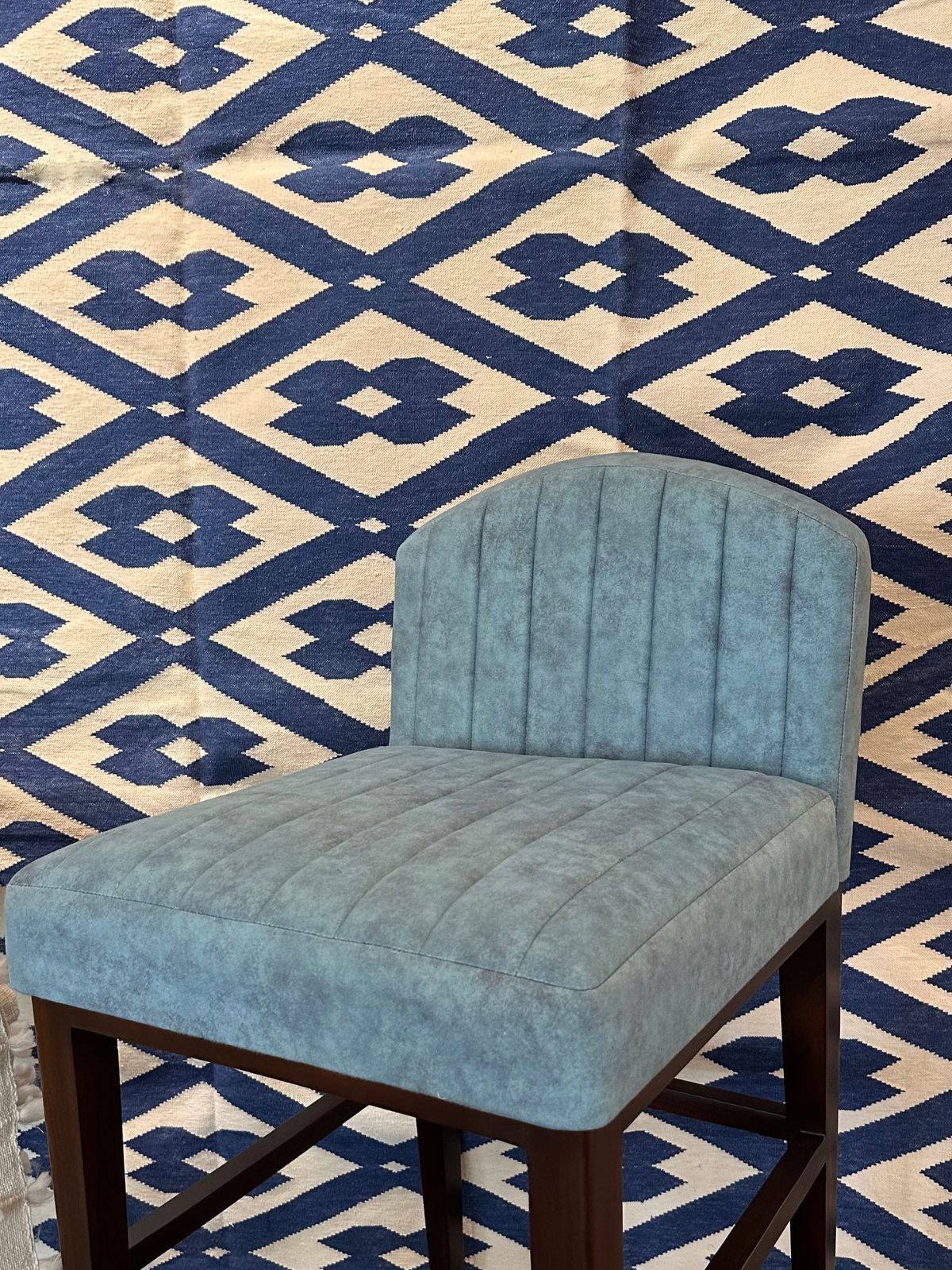 Blue indigo geometric rug close-up showing the cotton weave and geometric motif