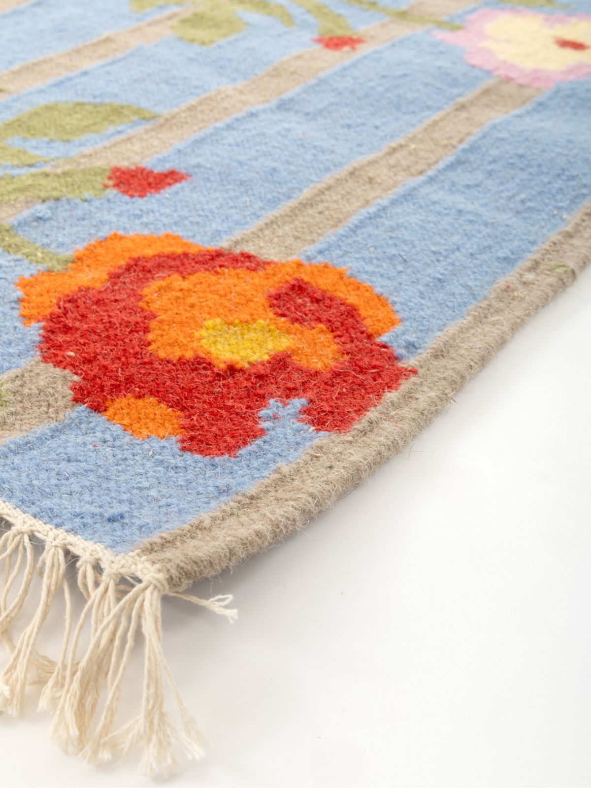 Bluebell Vine Flatweave Rug close-up showing the cotton pile and floral motif