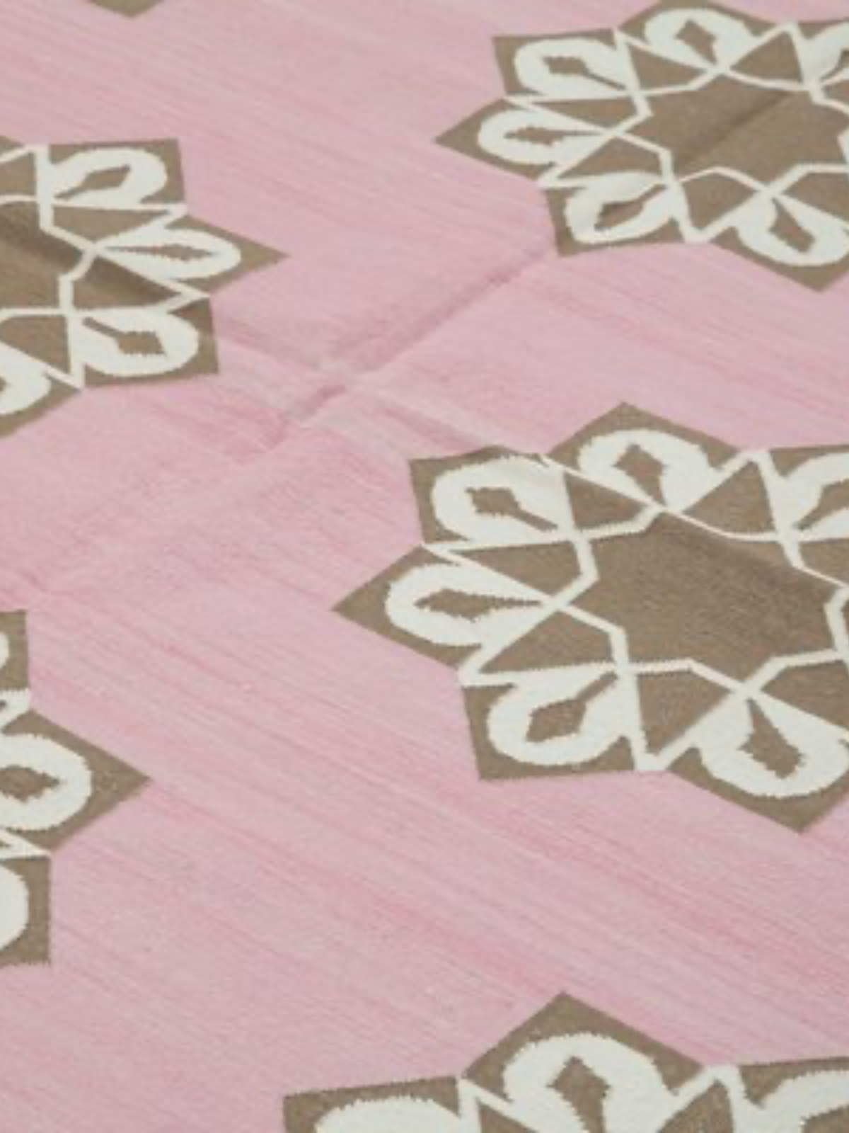 Blush Bloom Flatweave Rug- Pink cotton rug styled in a living room interior