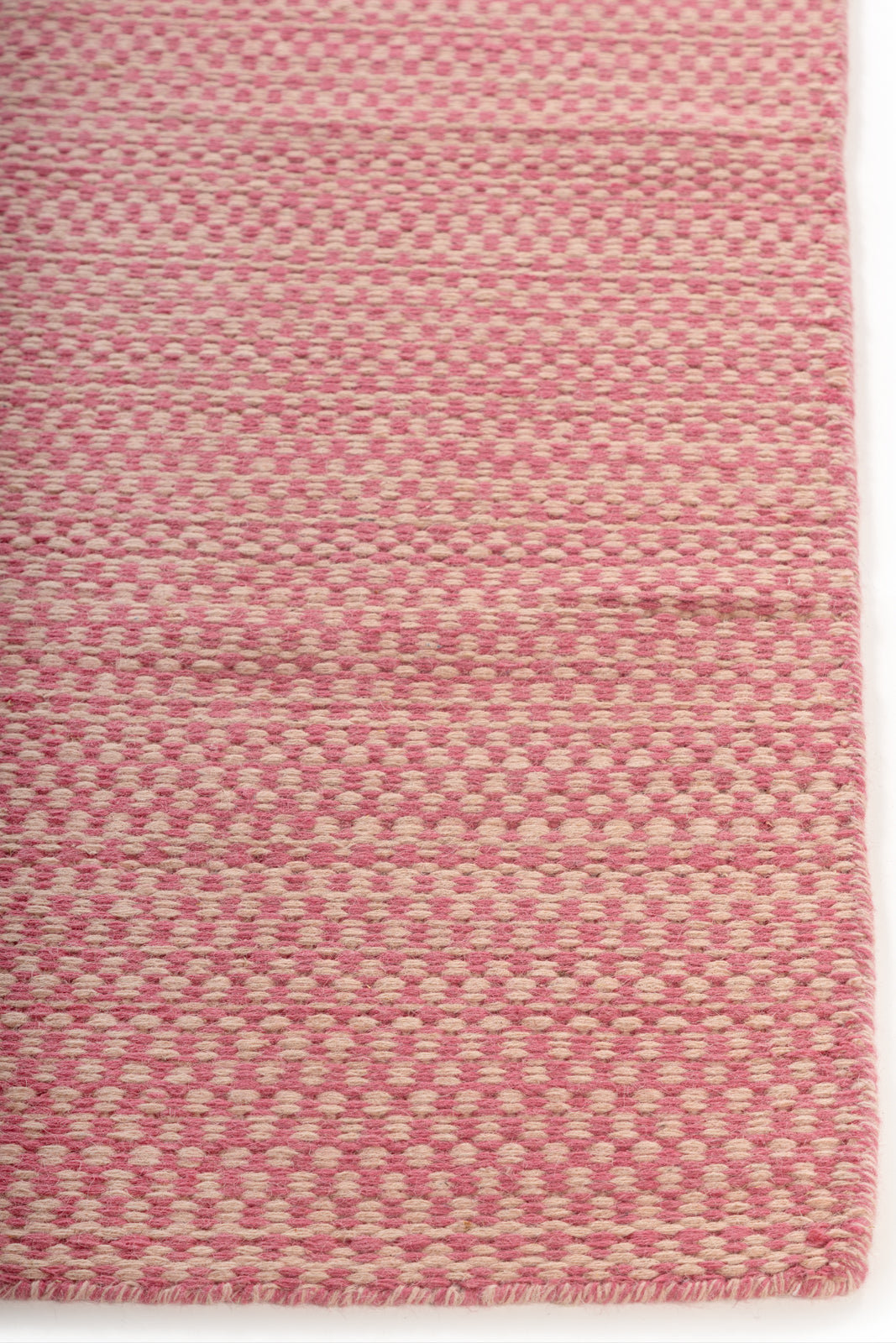 Blush Horizon Wool Rug wool rug styled in a living room interior