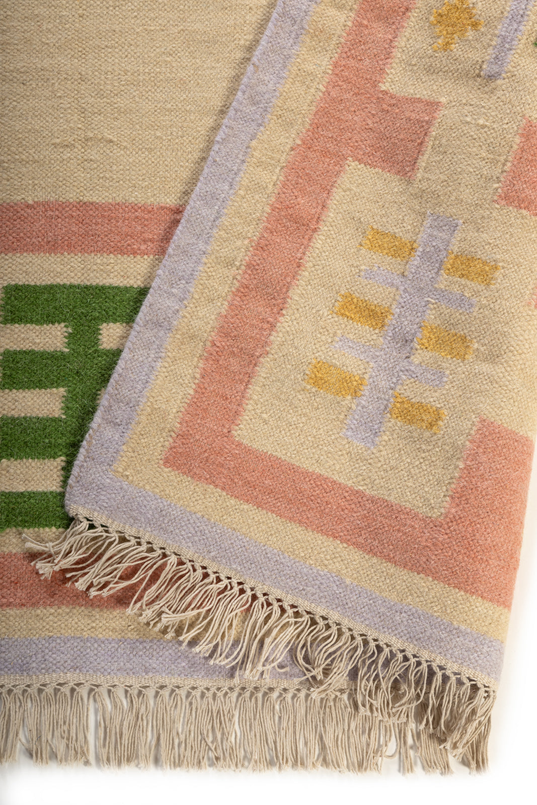 Blush Meadow Border Rug detail of the floral motif in wool cut pile