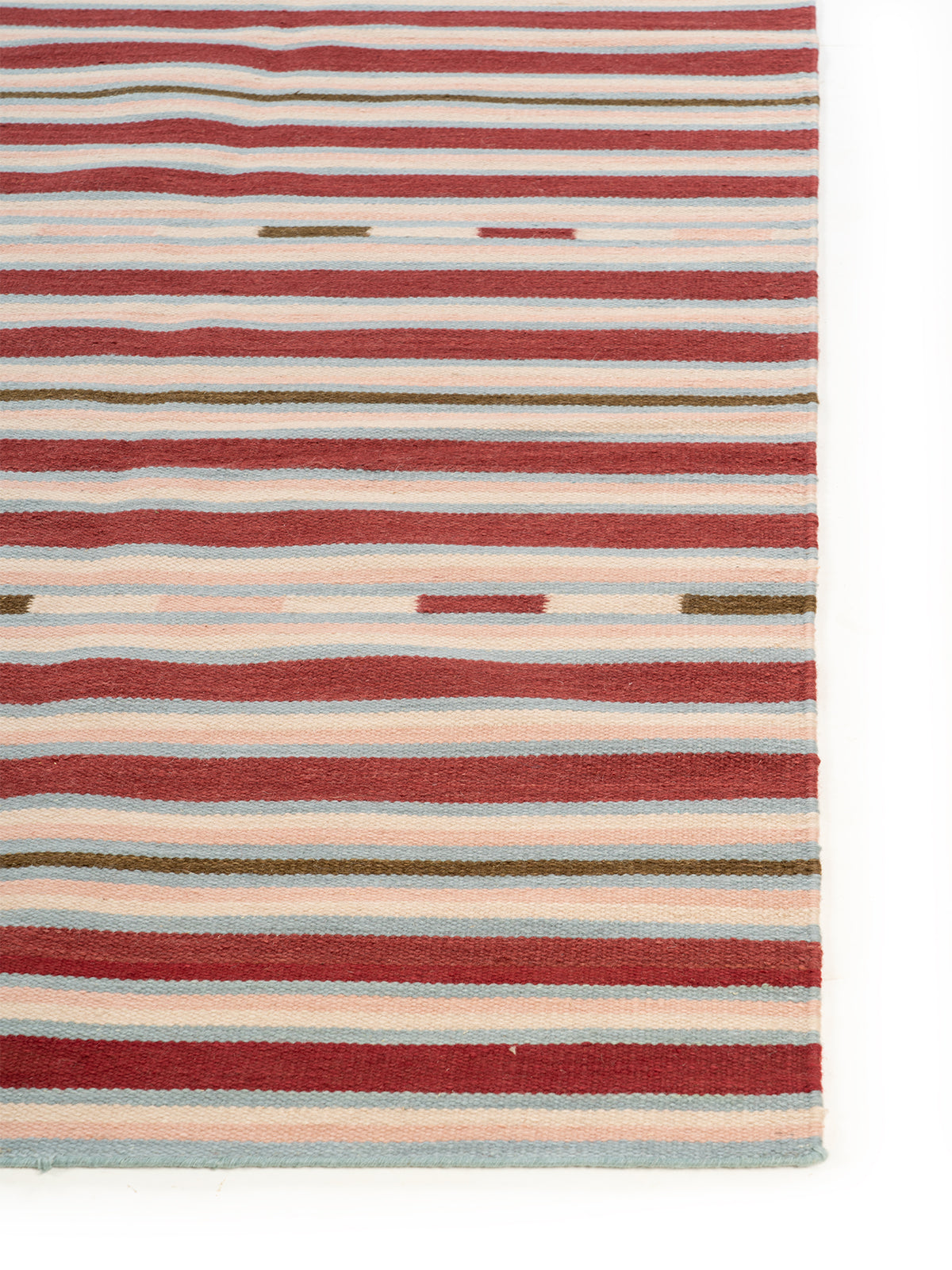 Bohemian Dash Stripe Rug wool rug styled in a living room interior
