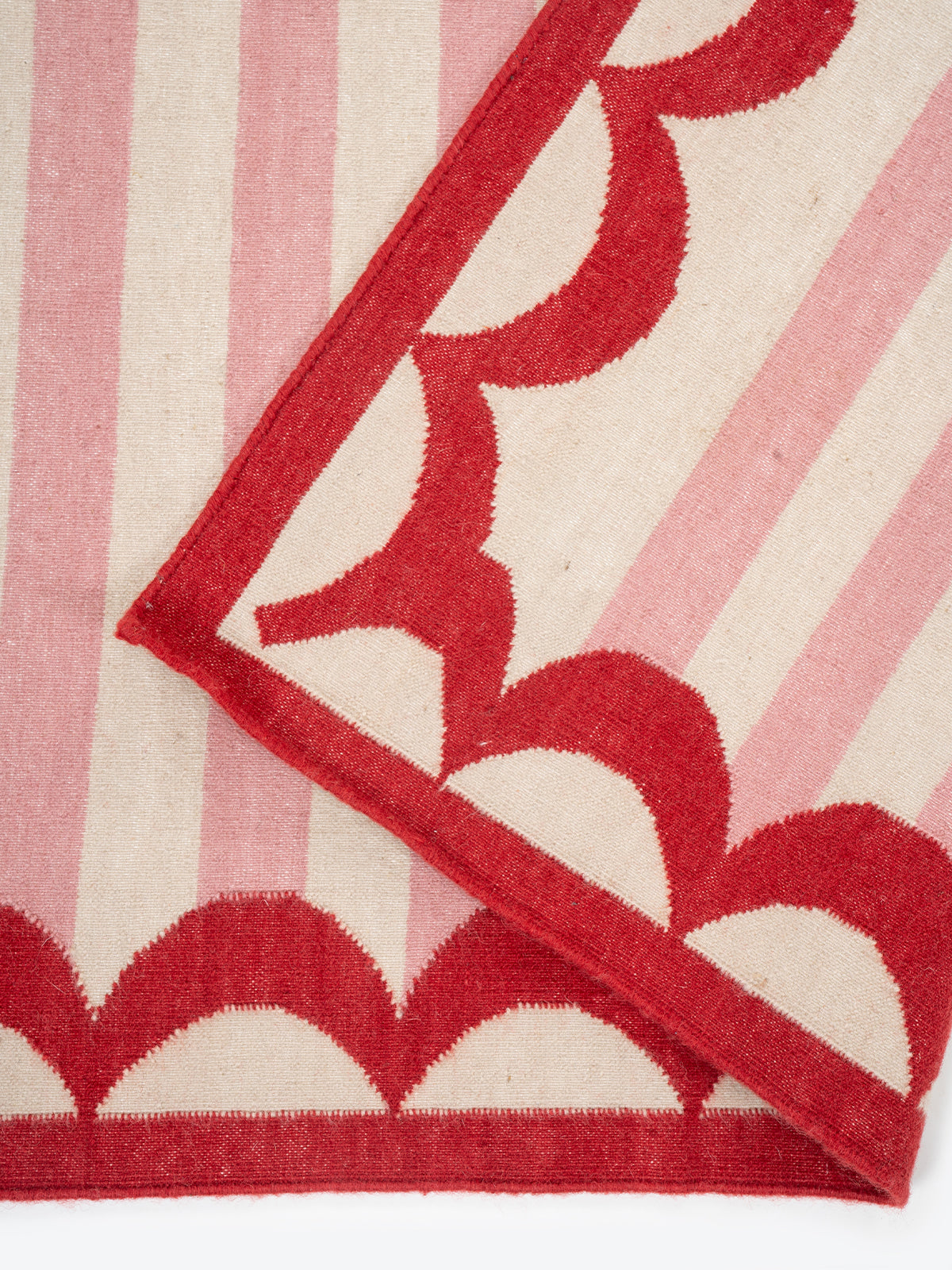 Carousel Stripe Wool Rug detail of the striped wool surface and edge finishing