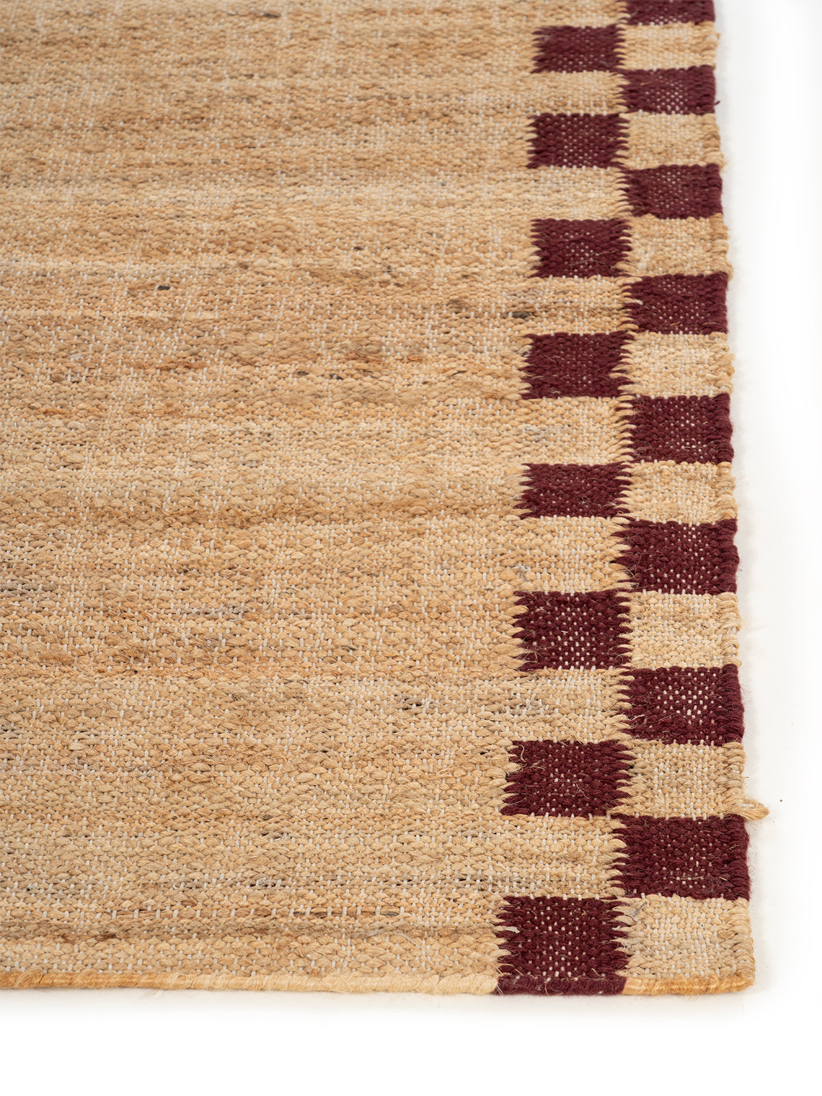 Checkerboard Border Jute Runner - jute runner laid in a hallway view