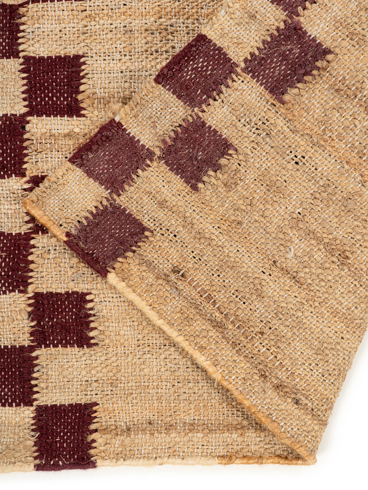 Checkerboard Border Jute Runner detail showing edge binding and jute finishing of the runner