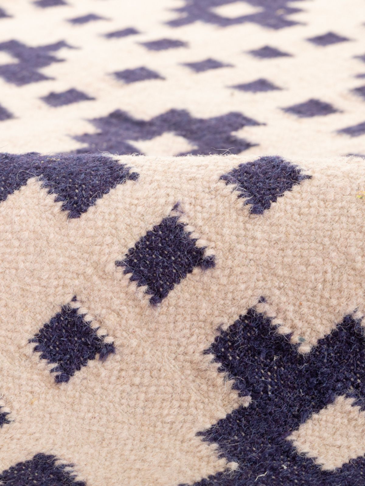 Checkerboard Kilim Wool Flatweave Rug detail of the geometric pattern in wool