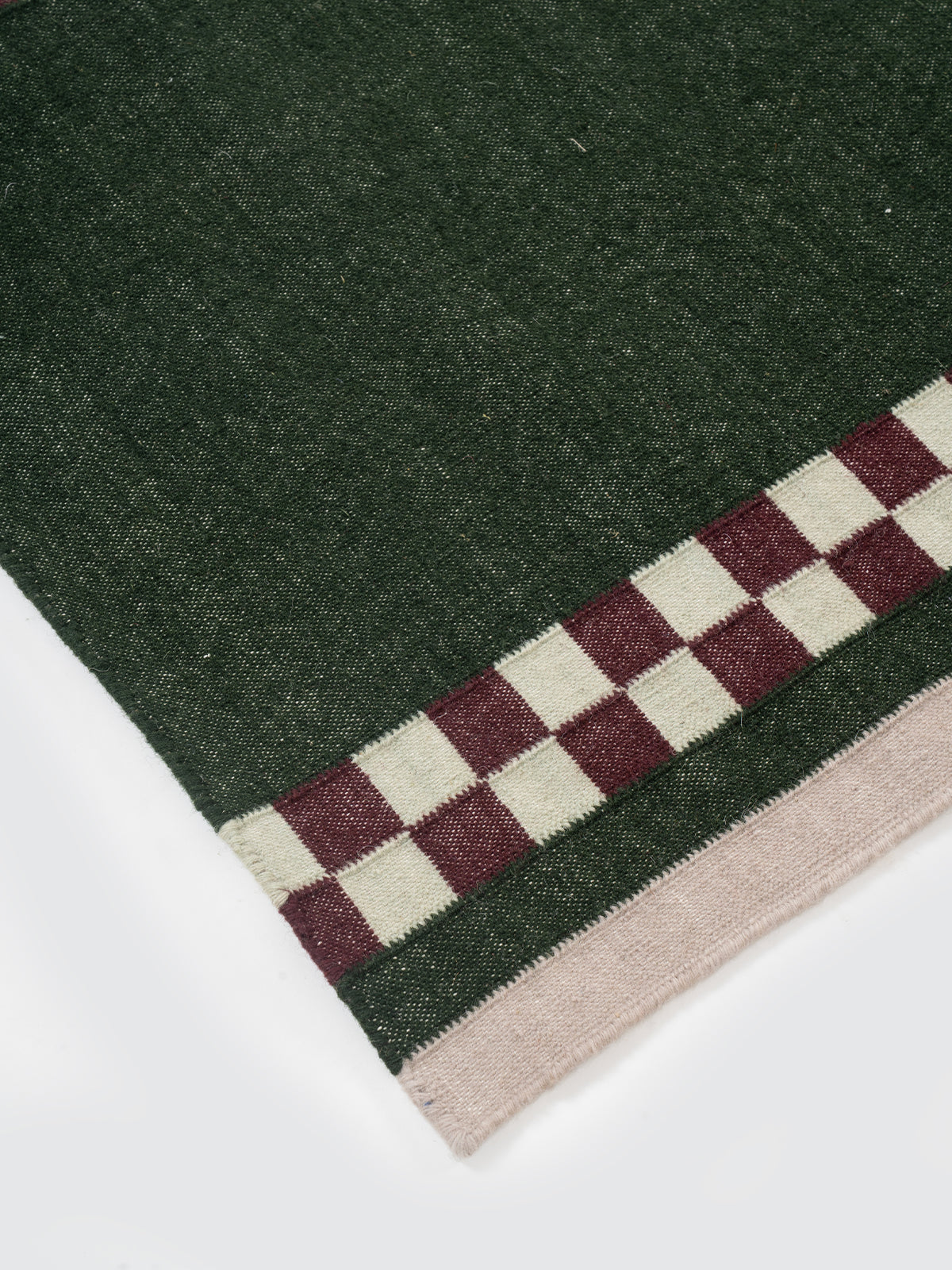 Checkerboard Stream Runner-Sage close-up showing the cotton weave and geometric surface