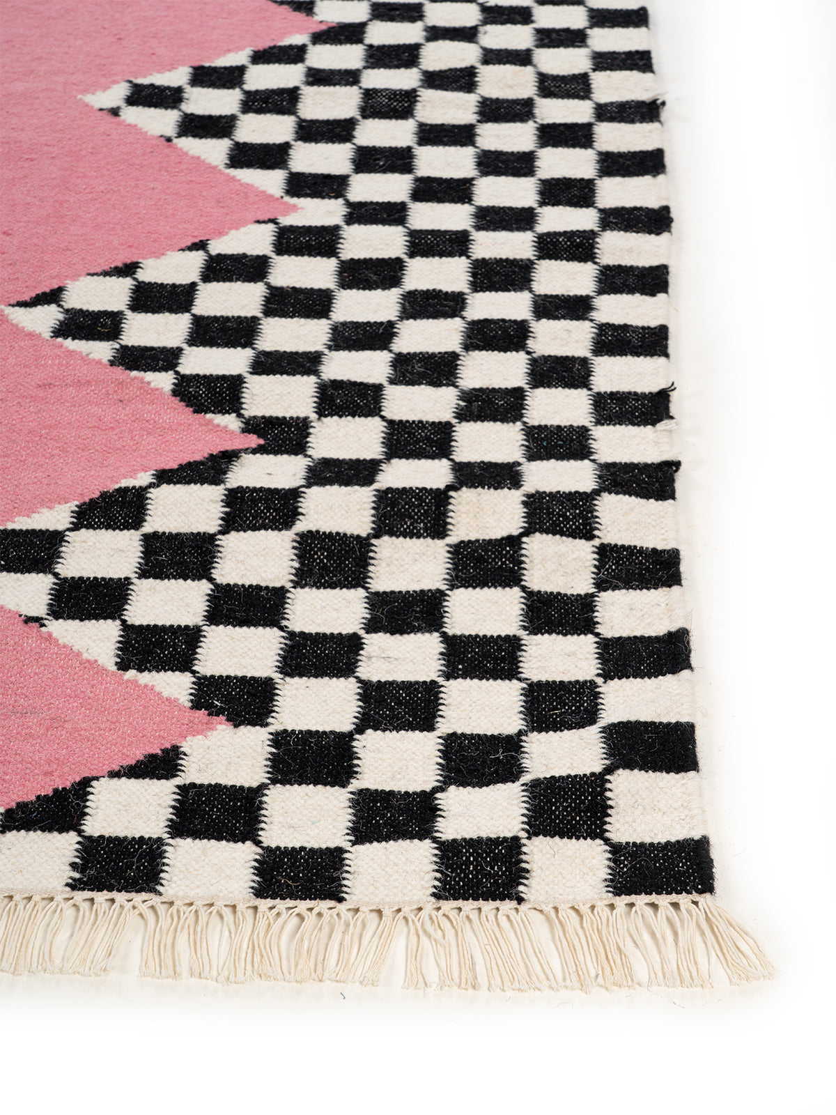 Checkerboard Zigzag Flatweave wool rug styled in a living room interior