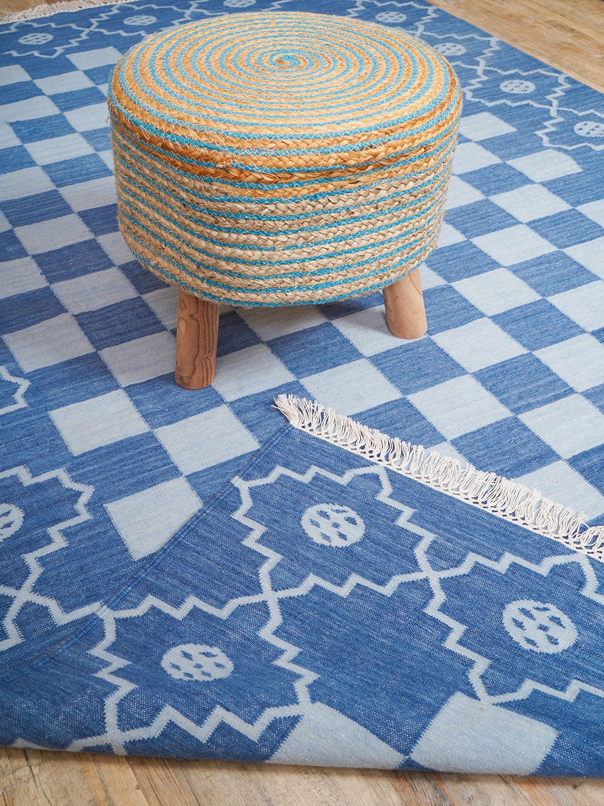 Checkered borderline Flatweave rug-Blue cotton rug styled in a living room interior