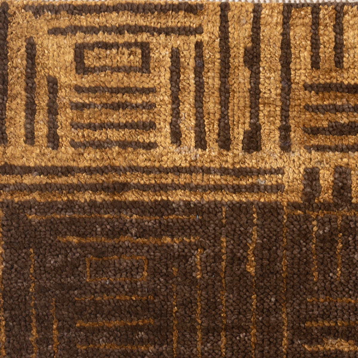 Cipher : Ancient Key close-up showing the bamboo silk weave and geometric motif