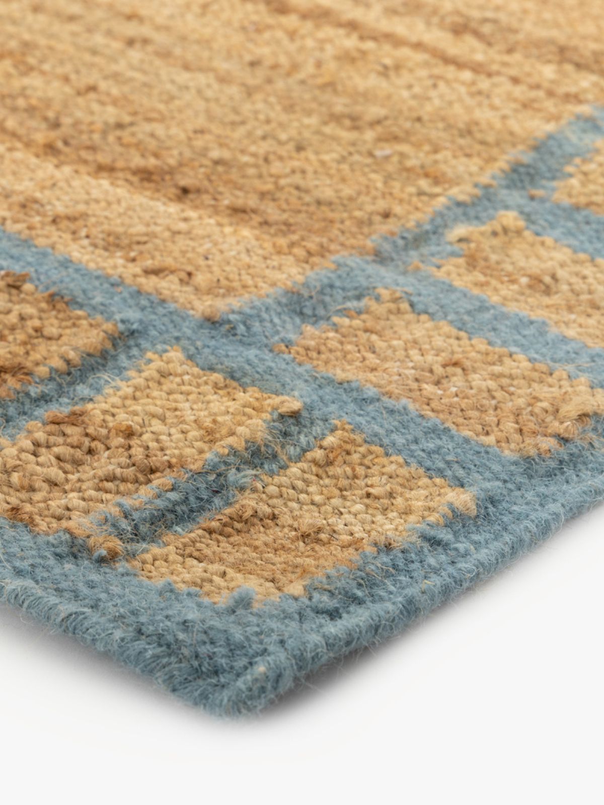 Coastal Blue Blockade Jute Rug close-up showing the jute weave and geometric motif
