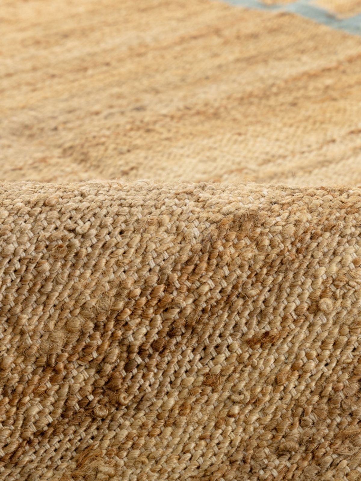 Coastal Blue Blockade Jute Rug detail of the geometric pattern in jute