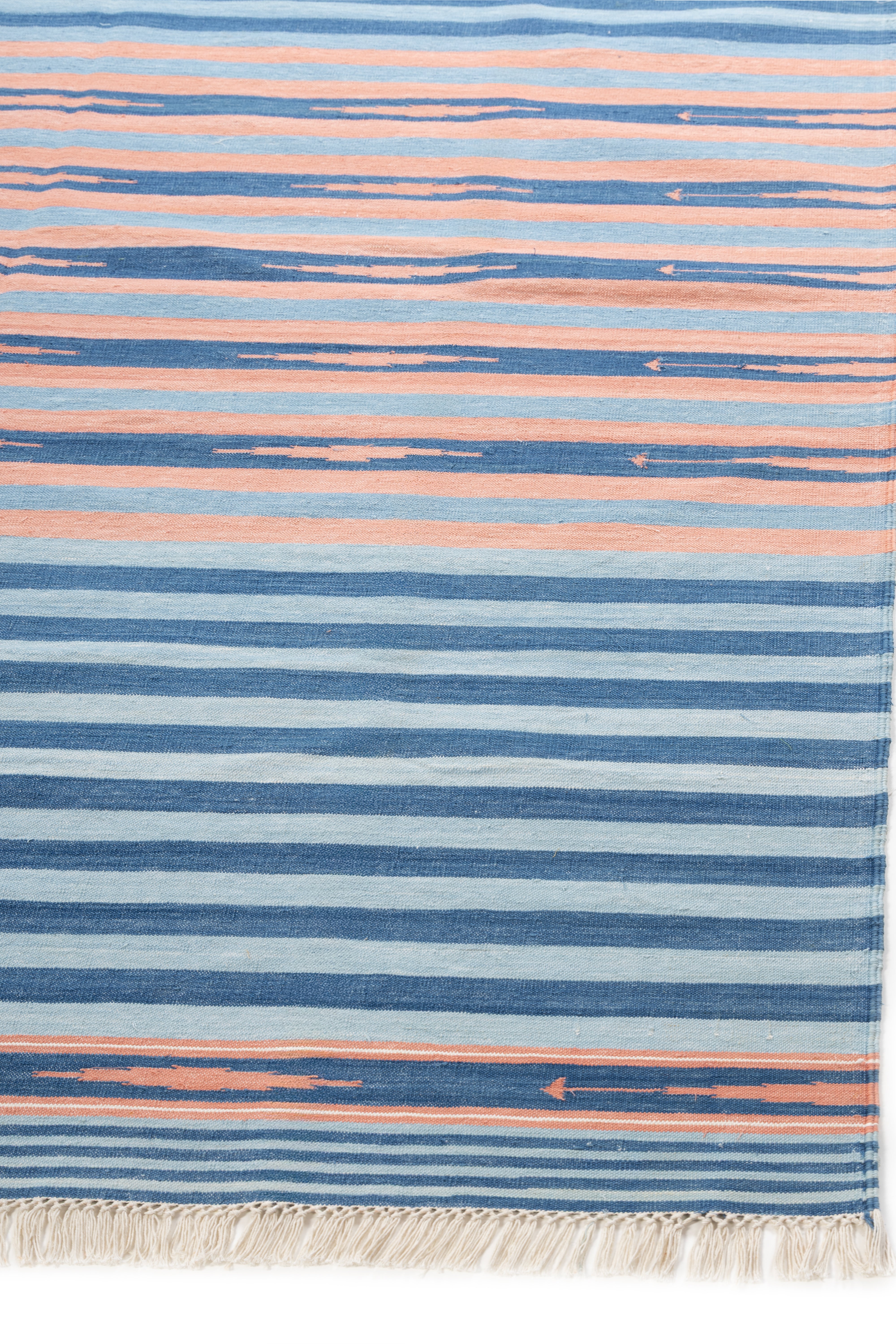 Coastal Dusk Stripe Dhurrie Rug cotton rug styled in a living room interior