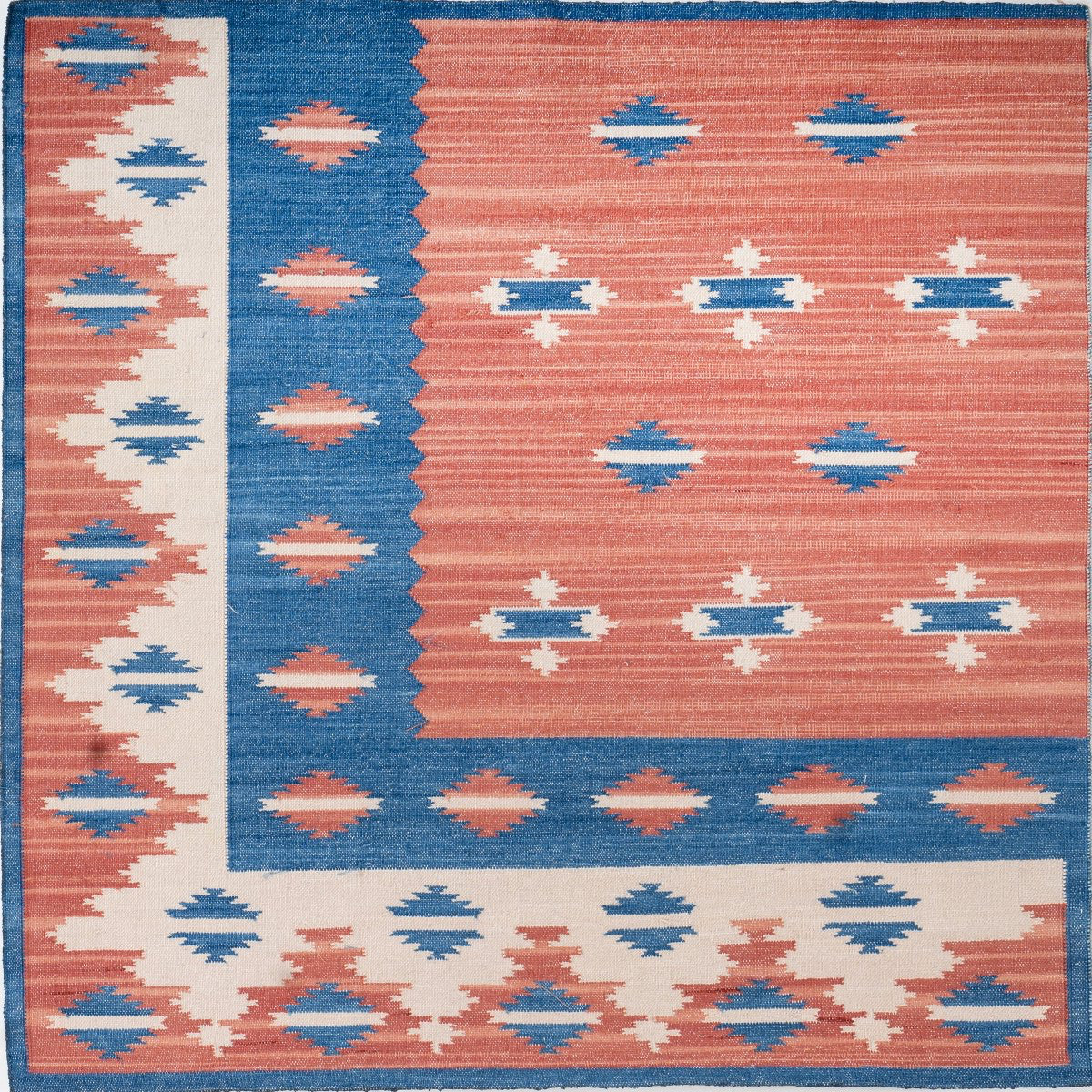 Coral Silk Heritage close-up showing the raw silk weave and traditional motif