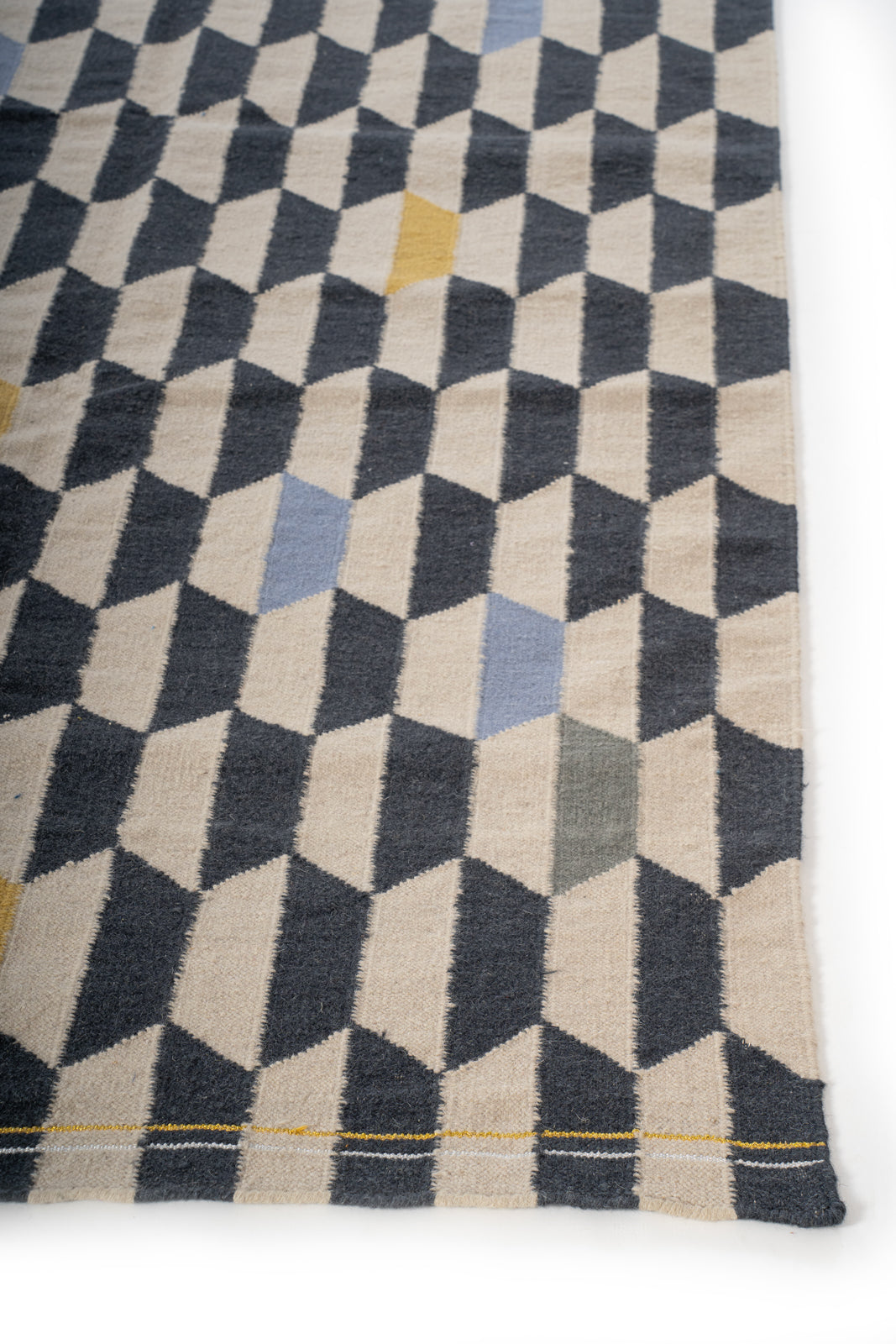 Cubist Reverie Flatweave Rug cotton rug styled in a living room interior