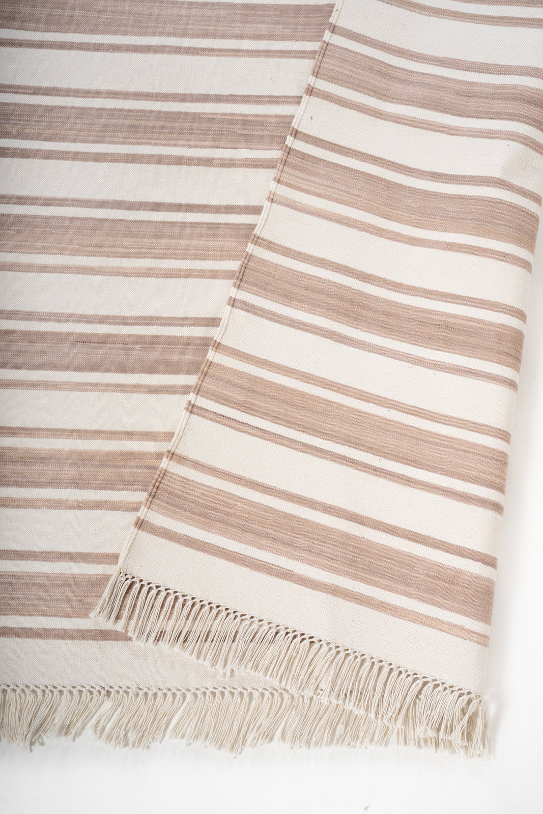 Darjeeling Drift Flatweave Rug detail of the striped cotton surface and edge finishing