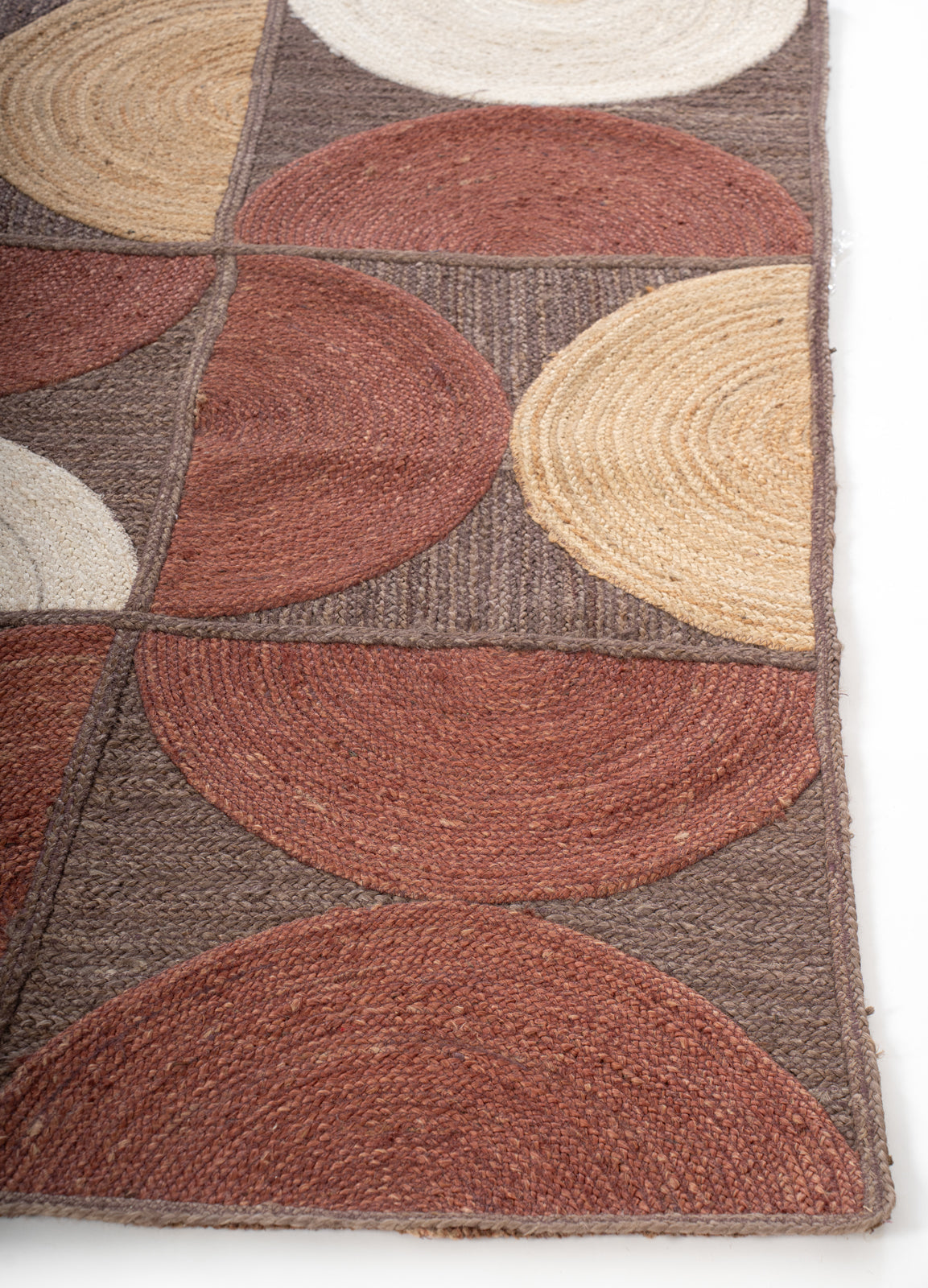 Dowa Geometric Braided Rug cotton rug styled in a living room interior