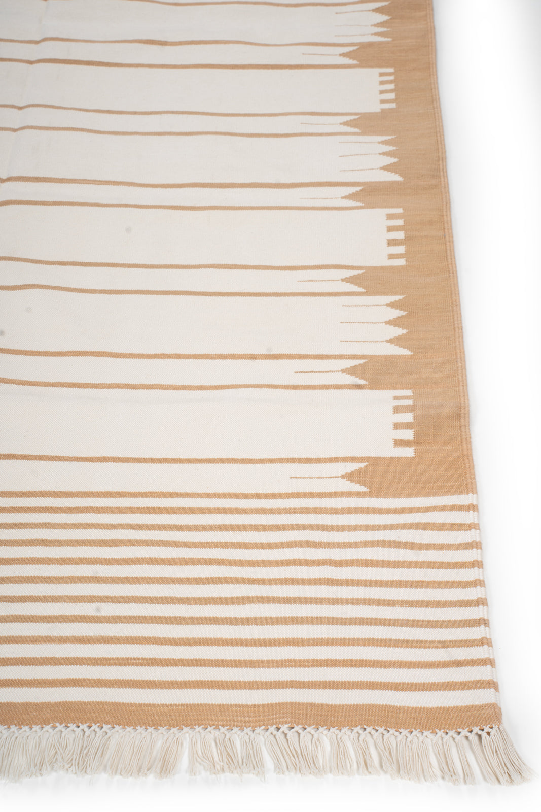 Dusky Arrows Flatweave Rug cotton rug styled in a living room interior