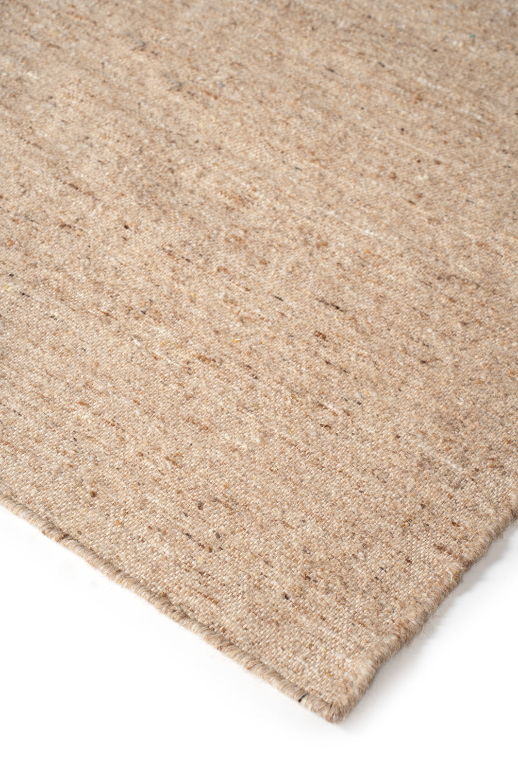 Earthen Essence Beige Wool Rug close-up showing the wool weave and surface texture