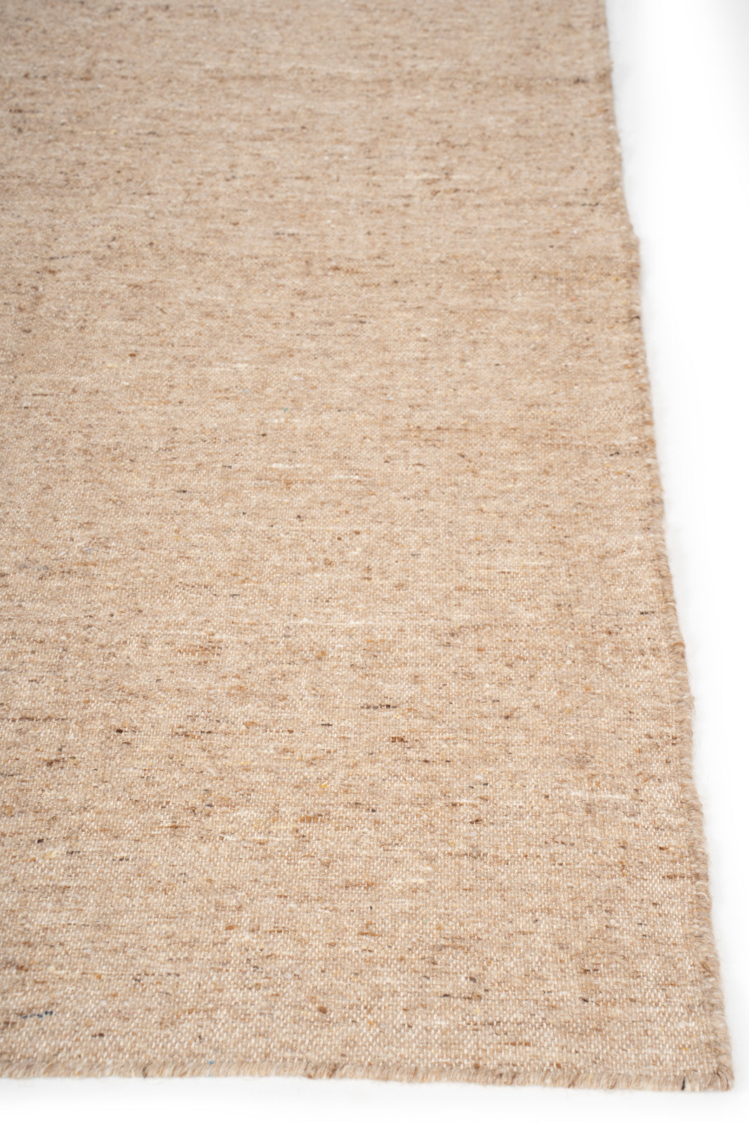 Earthen Essence Beige Wool Rug wool rug styled in a living room interior