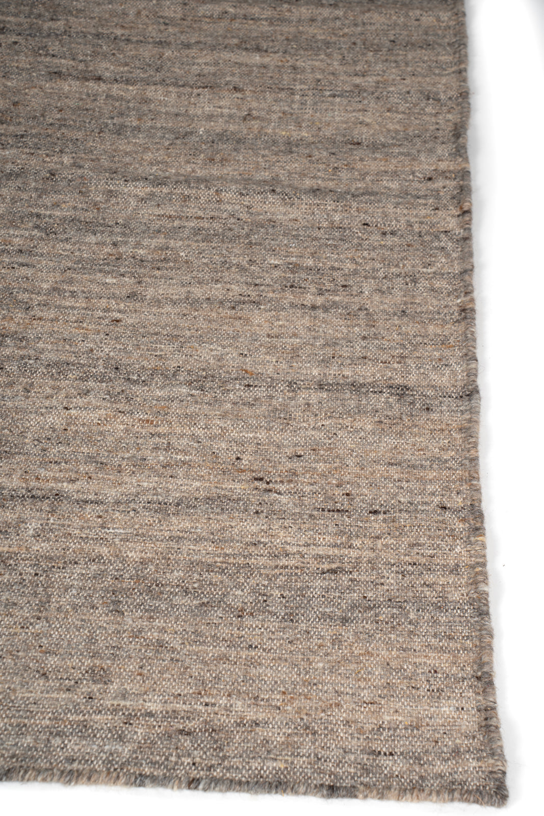 Earthen Essence Burnt Umber Wool Rug wool rug styled in a living room interior