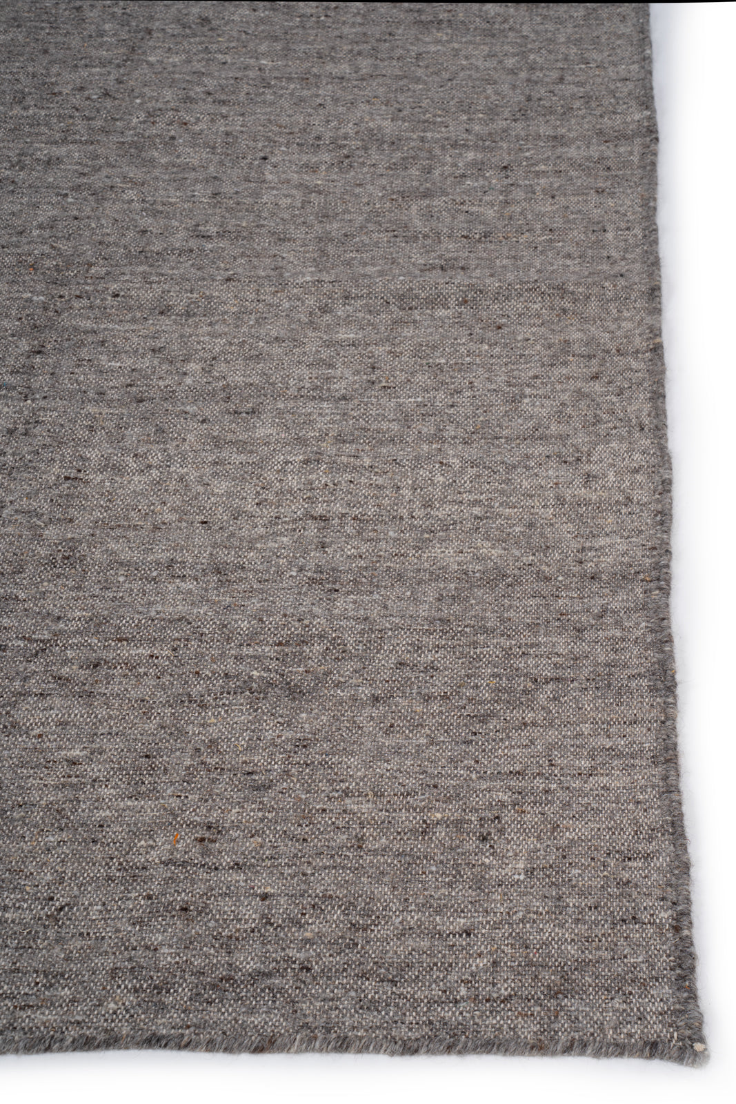 Earthen Essence Grey Wool Rug wool rug styled in a living room interior