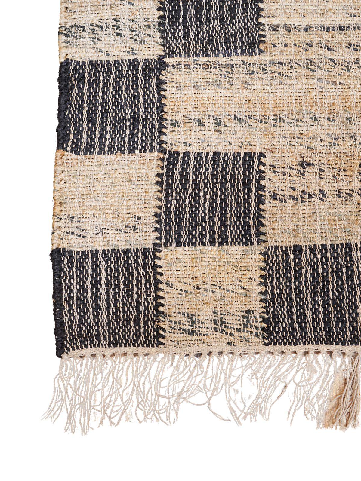 Ebony Checkered Jute Rug jute rug styled in a living room interior