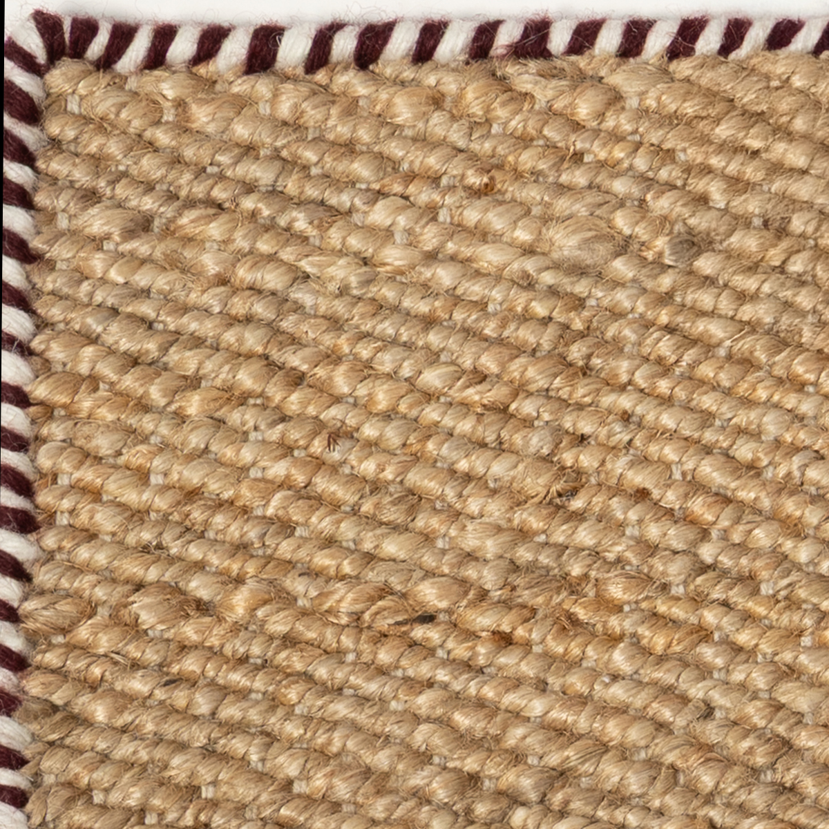 Edge - Earthen Rouge close-up showing the jute weave and surface texture