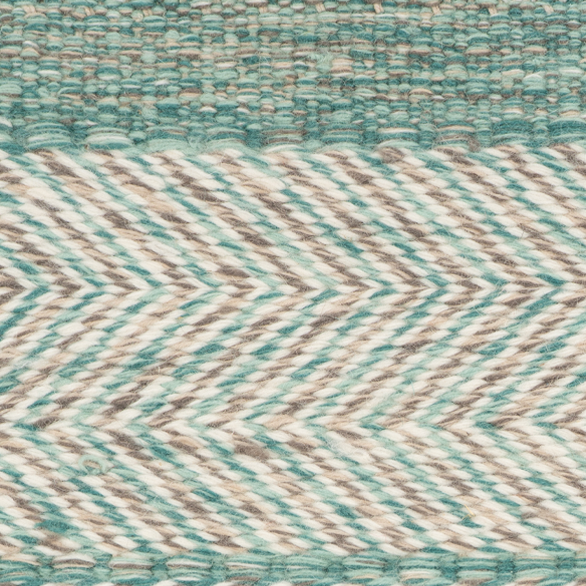Eira : Aqua Drift close-up showing the wool weave and geometric motif