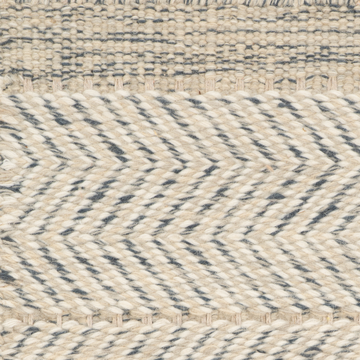 Eira : Stone Mist close-up showing the wool weave and surface texture