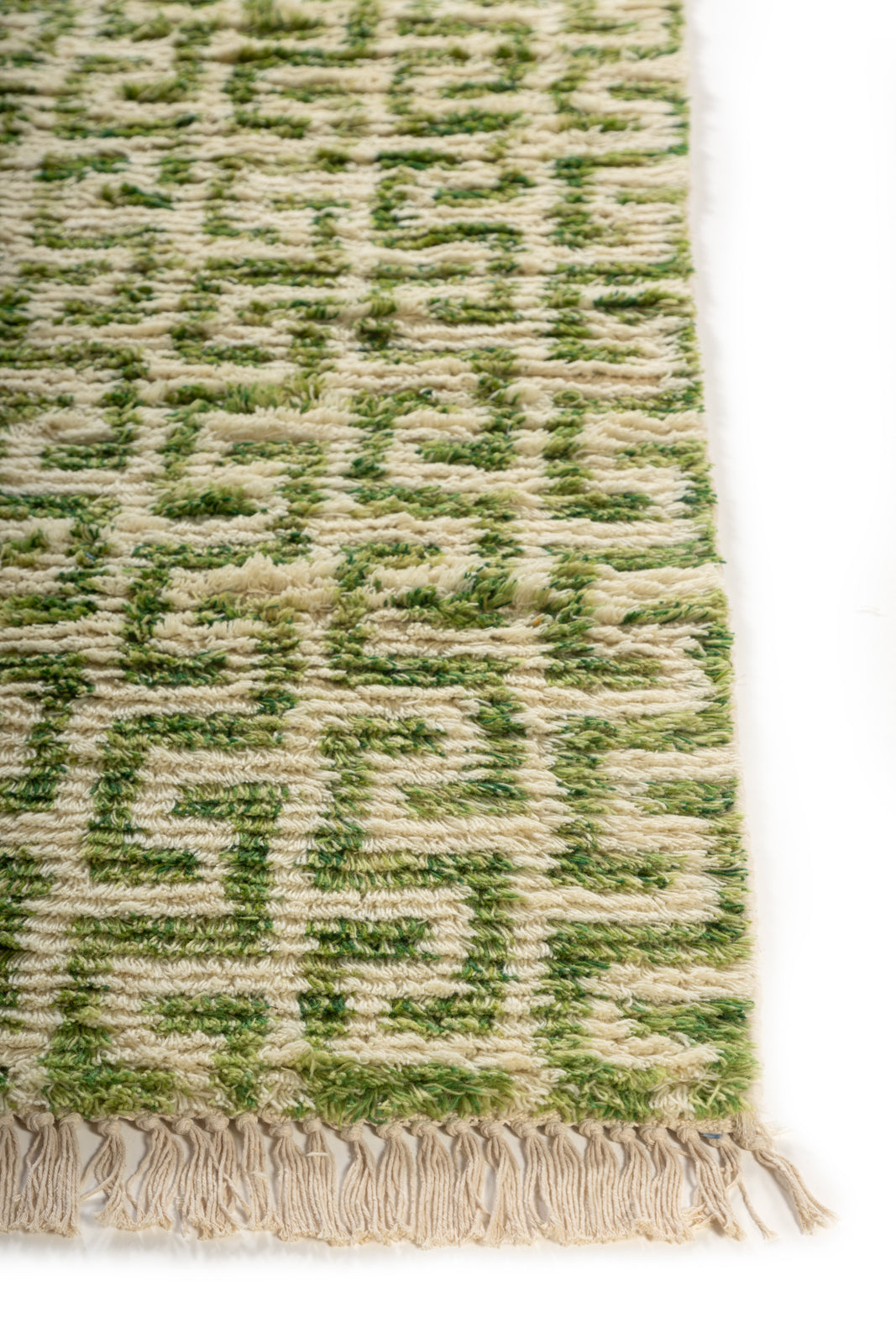 Emerald Maze Wool Rug wool rug styled in a living room interior