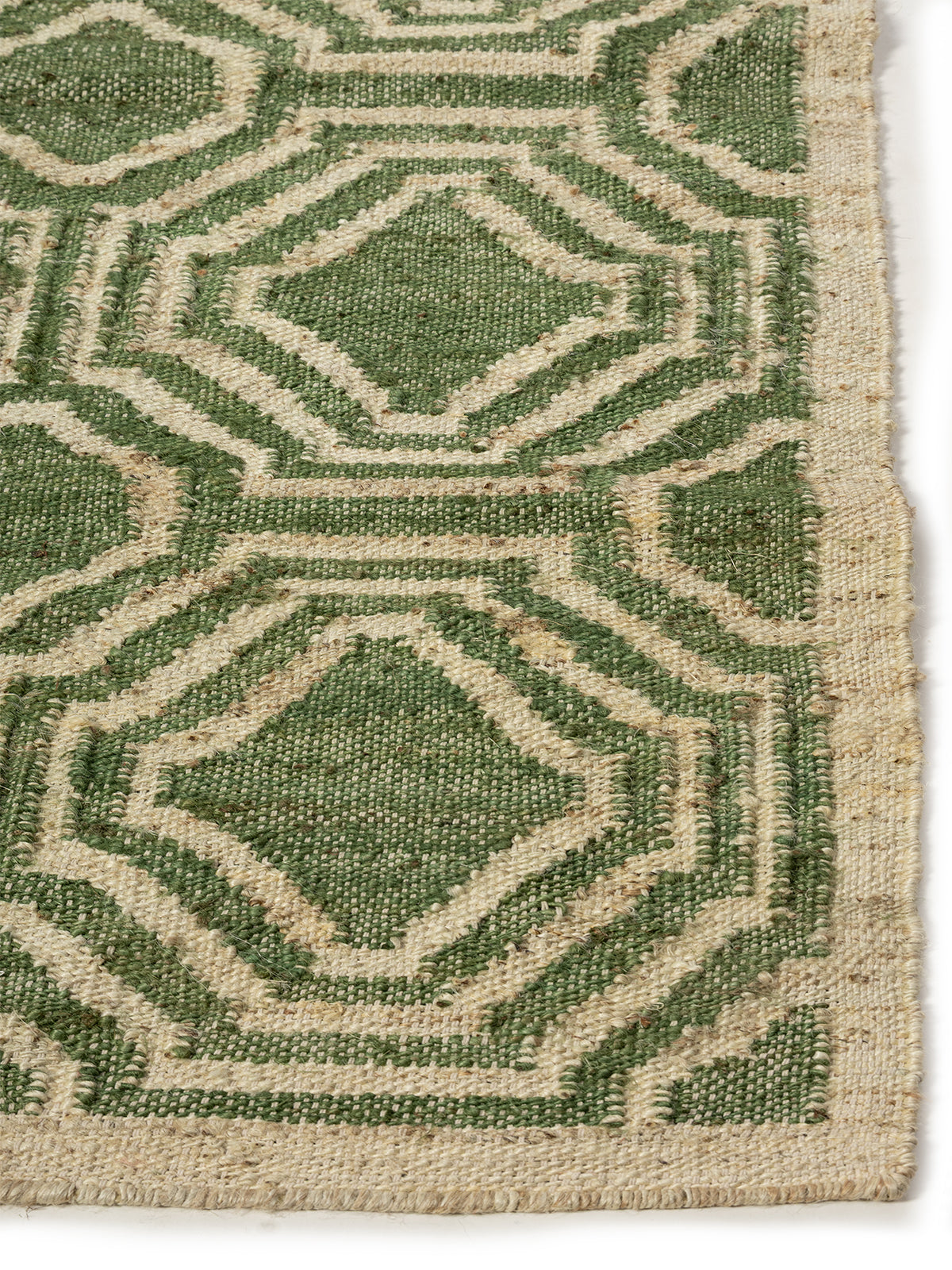 Emerald Trellis Jute Rug jute rug styled in a living room interior