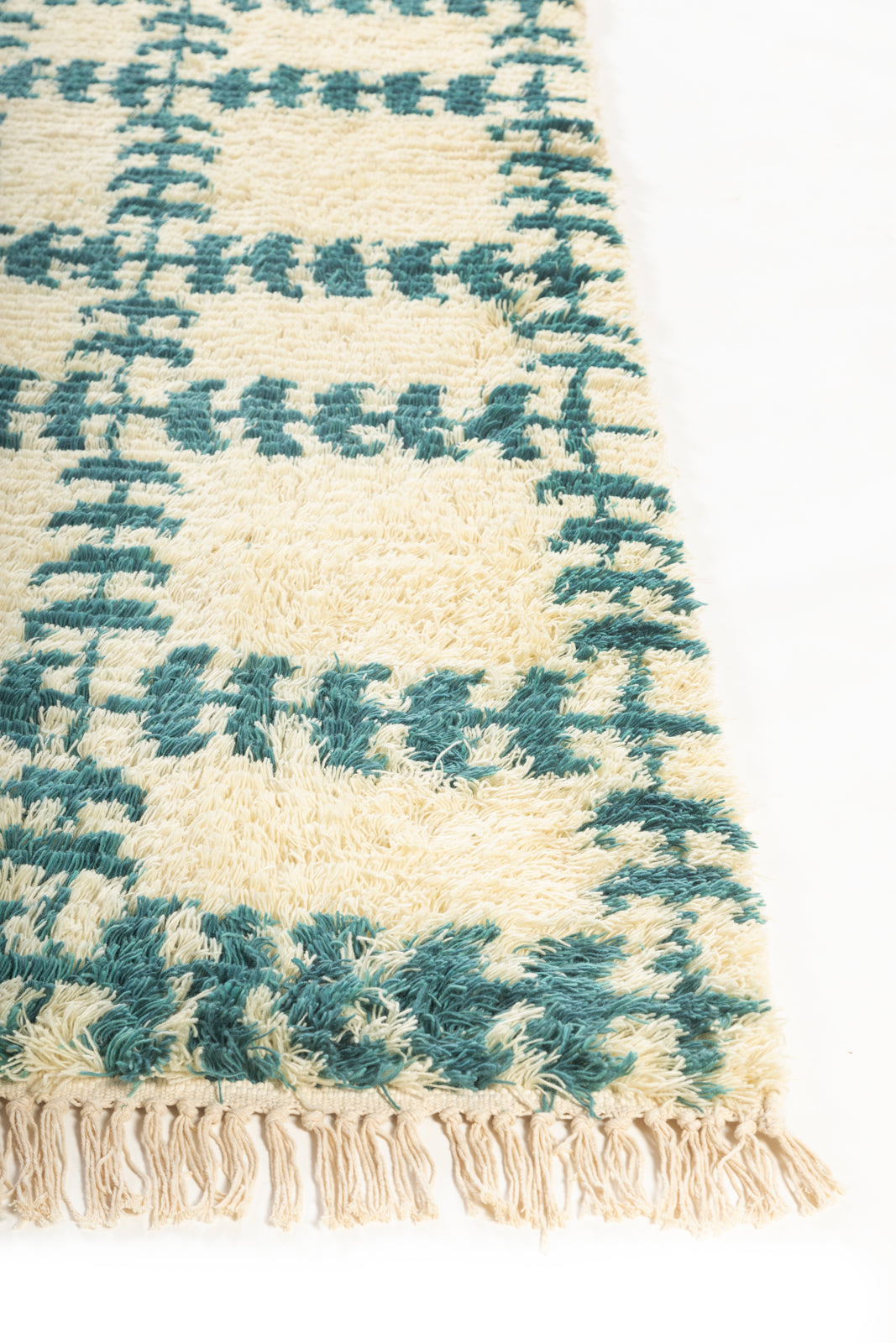 Emerald Weave Wool Rug wool rug styled in a living room interior