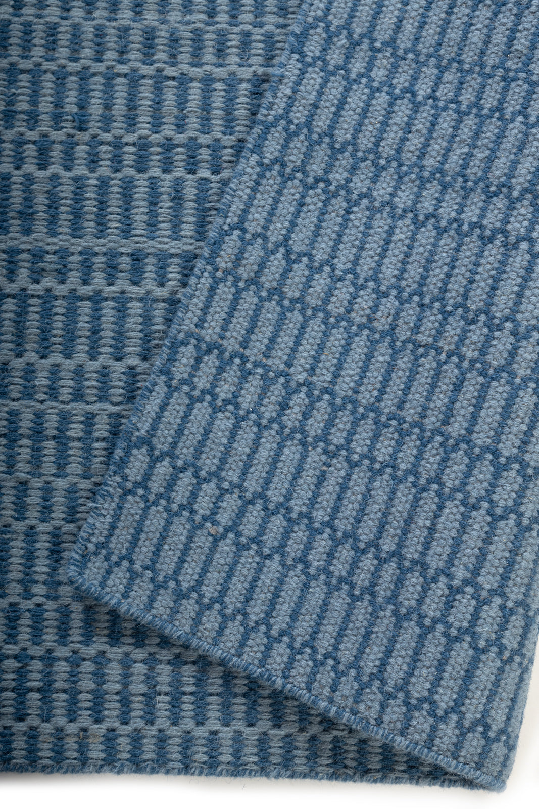 Farringdon Rug detail showing the textured wool surface and finishing