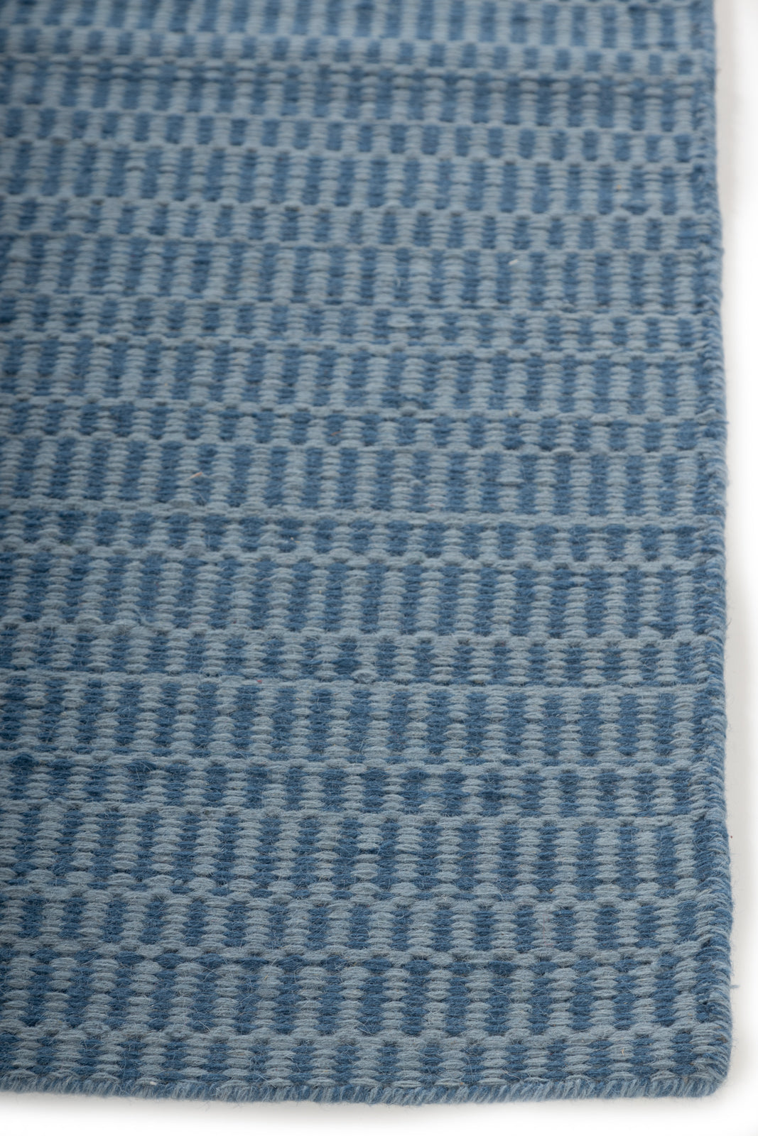 Farringdon Rug wool rug styled in a living room interior