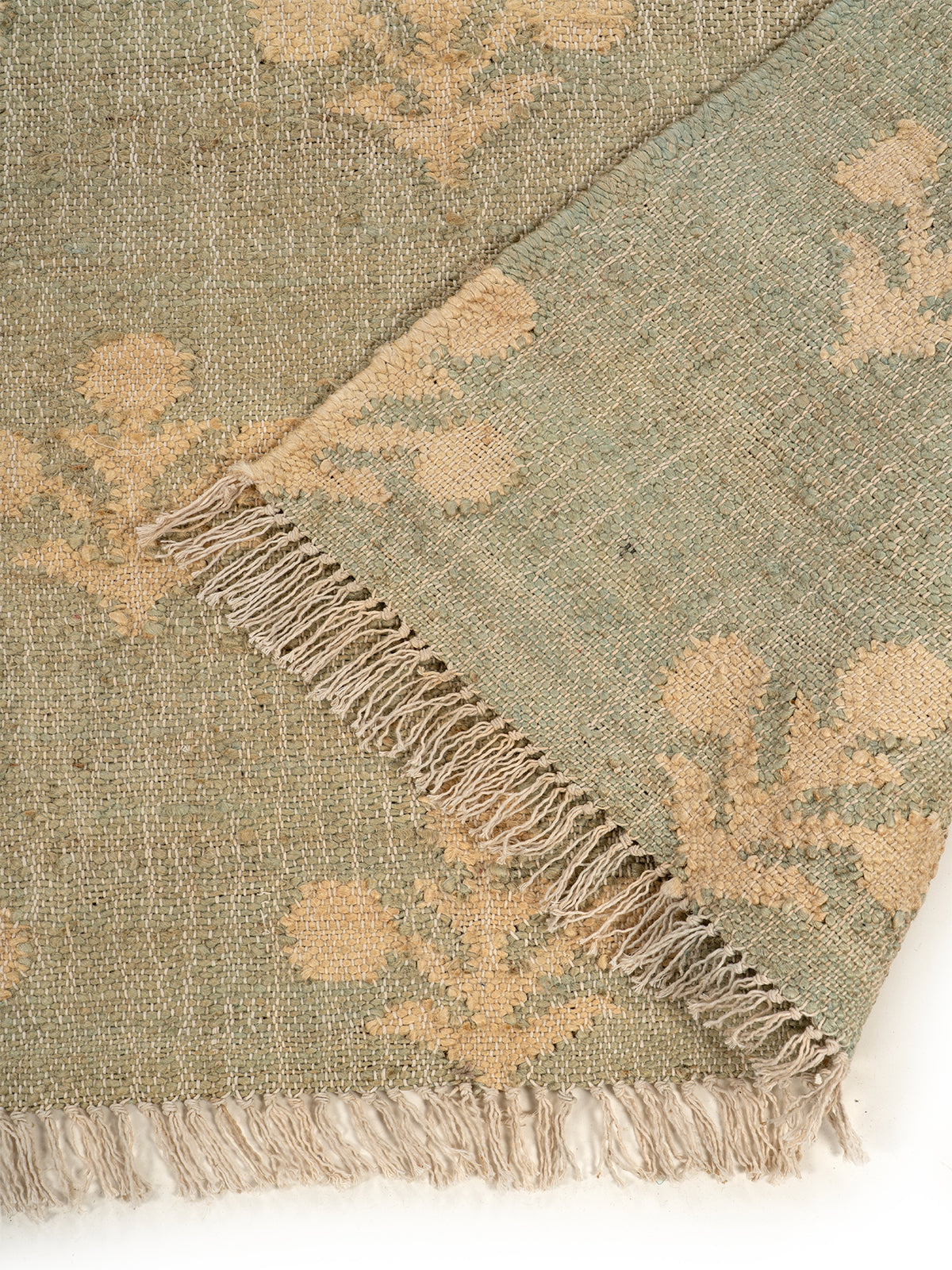 Fern Valley Jute Rug detail of the floral motif in jute cut pile