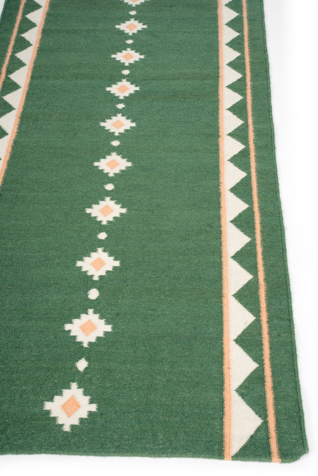 Forest Ember Dhurrie Runner - cotton runner laid in a hallway view