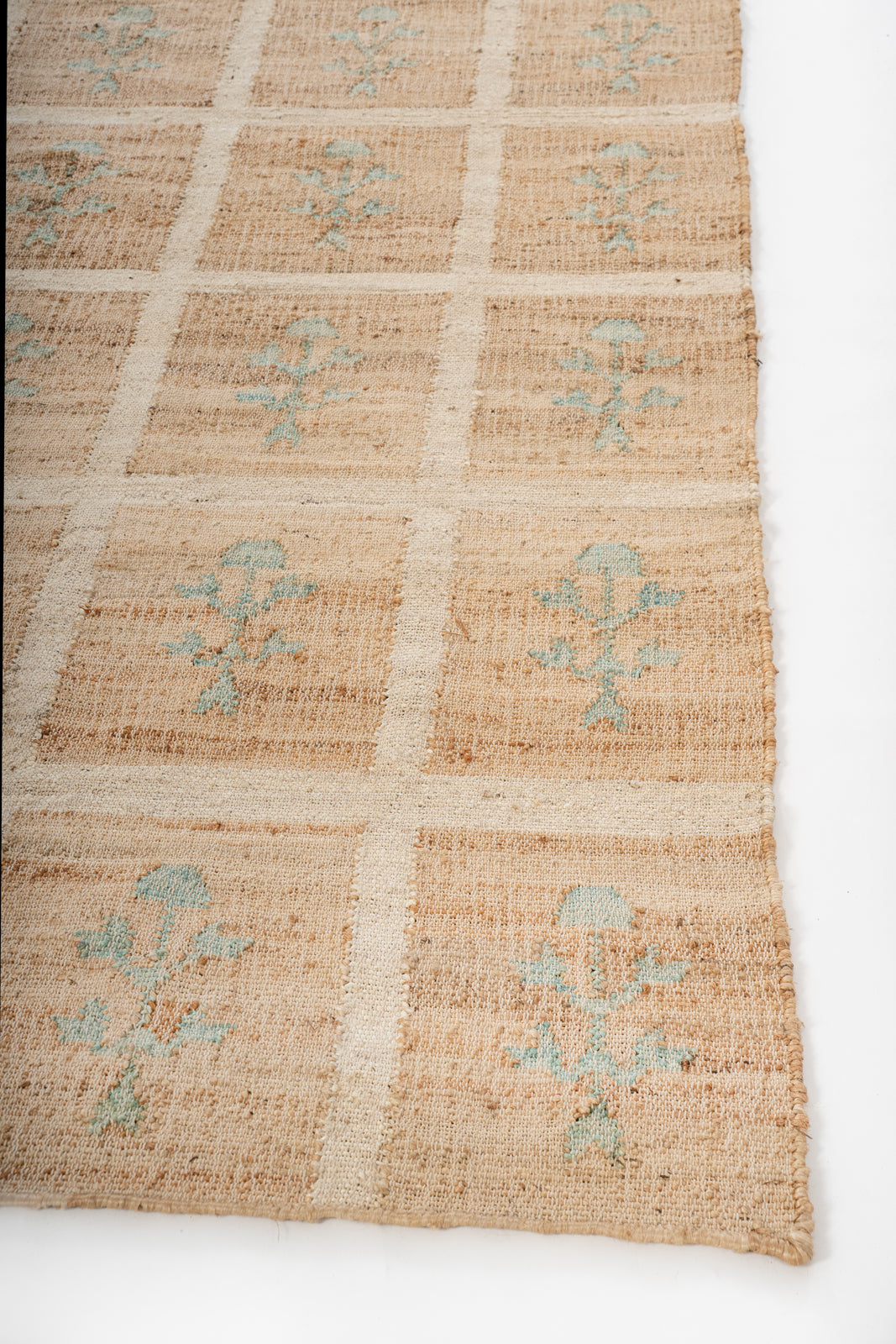 Forest Grid Jute Rug jute rug styled in a living room interior